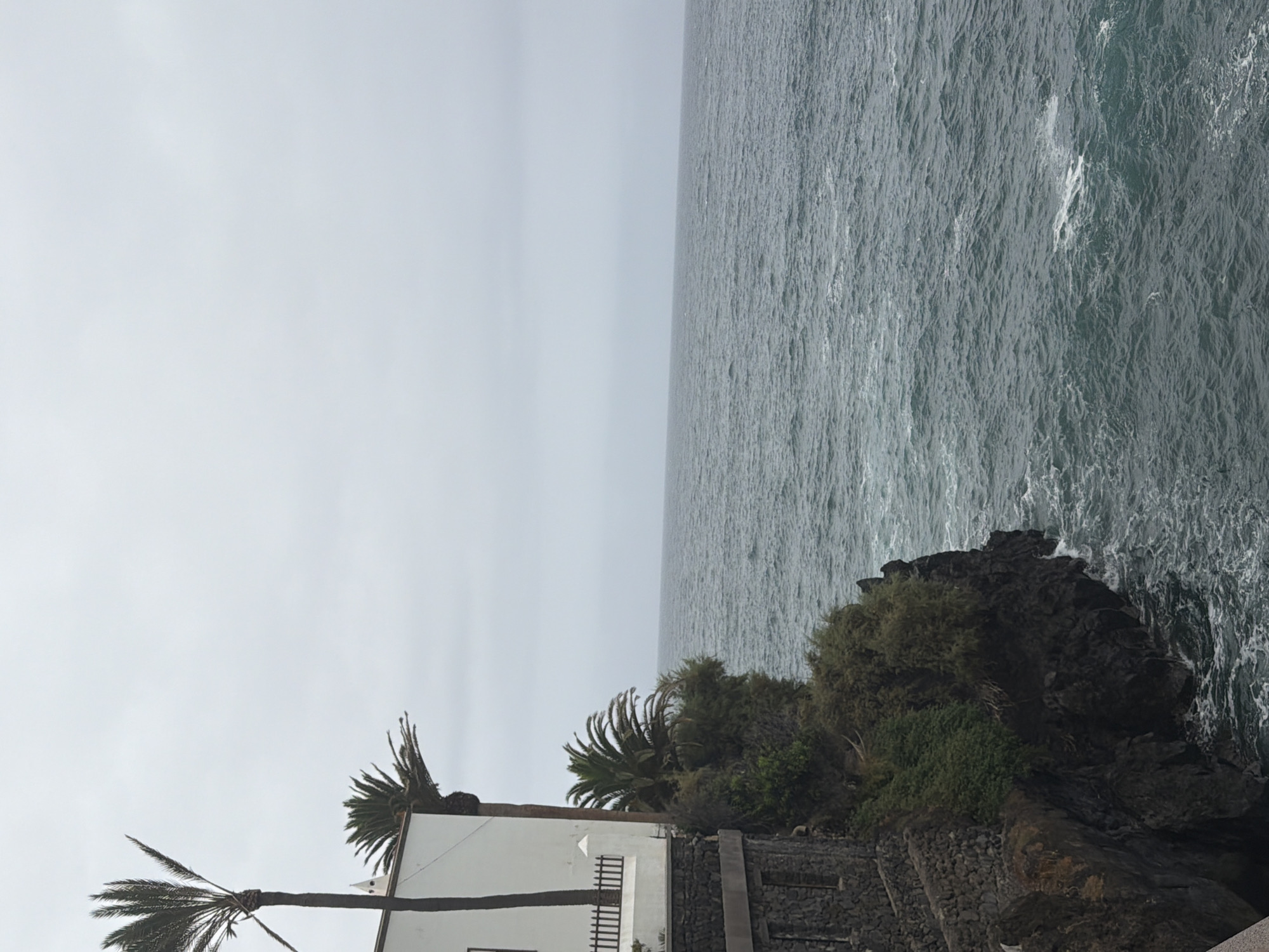 Rough waves hit Puerto de la Cruz's volcanic coastline