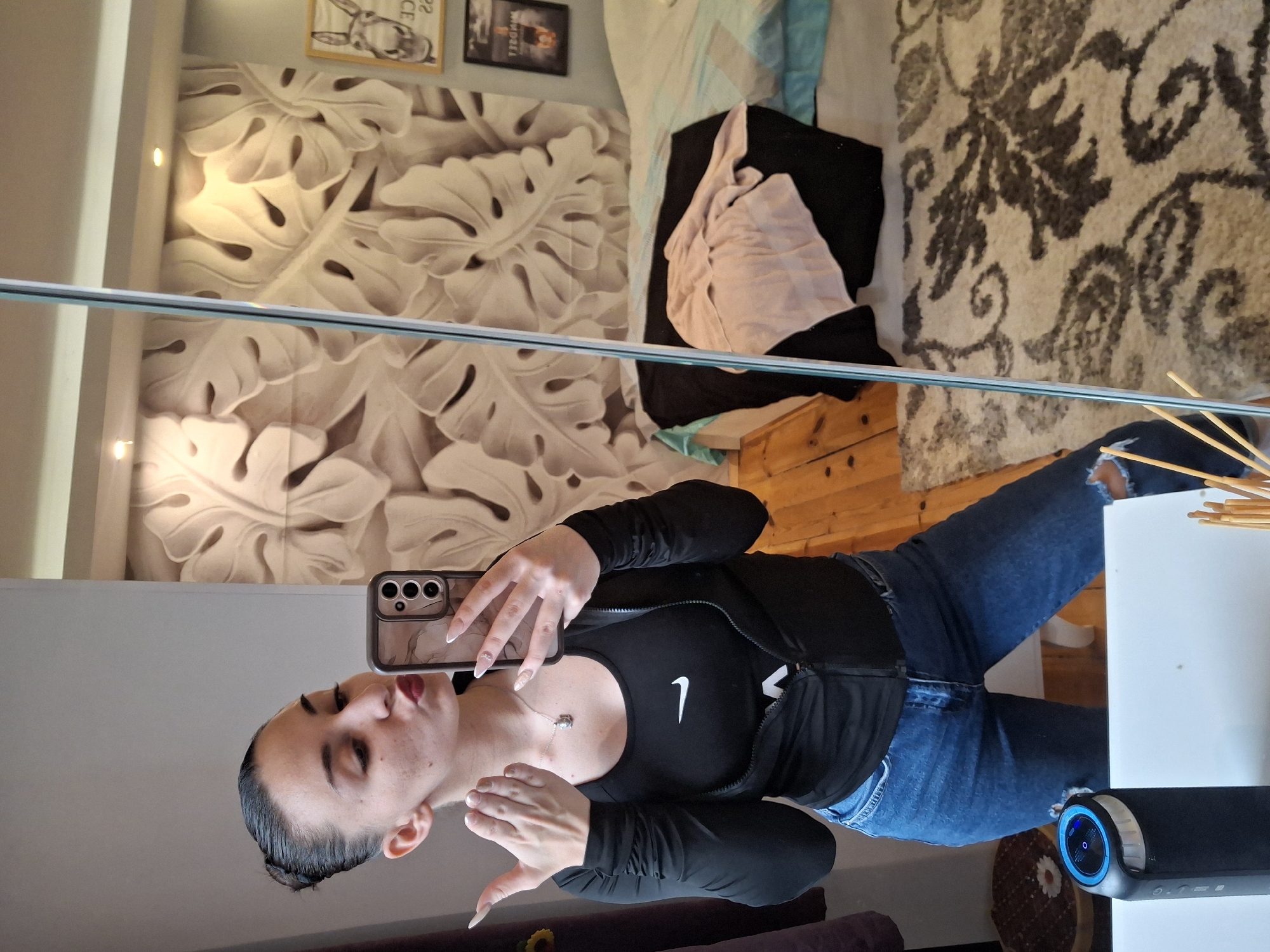 Woman takes mirror selfies in bedroom in Buhovo Bulgaria