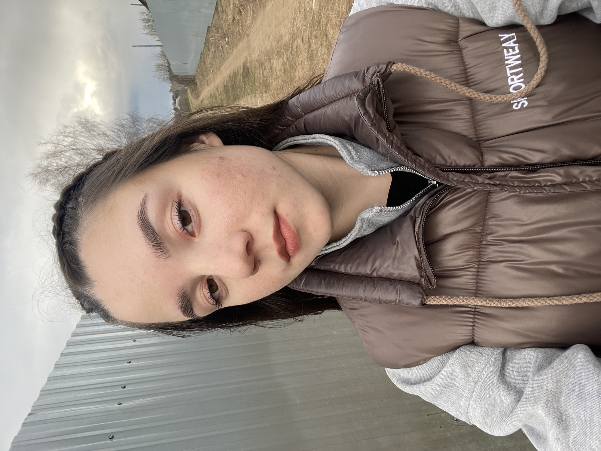 Young person takes outdoor selfies in Ольховка, Russia