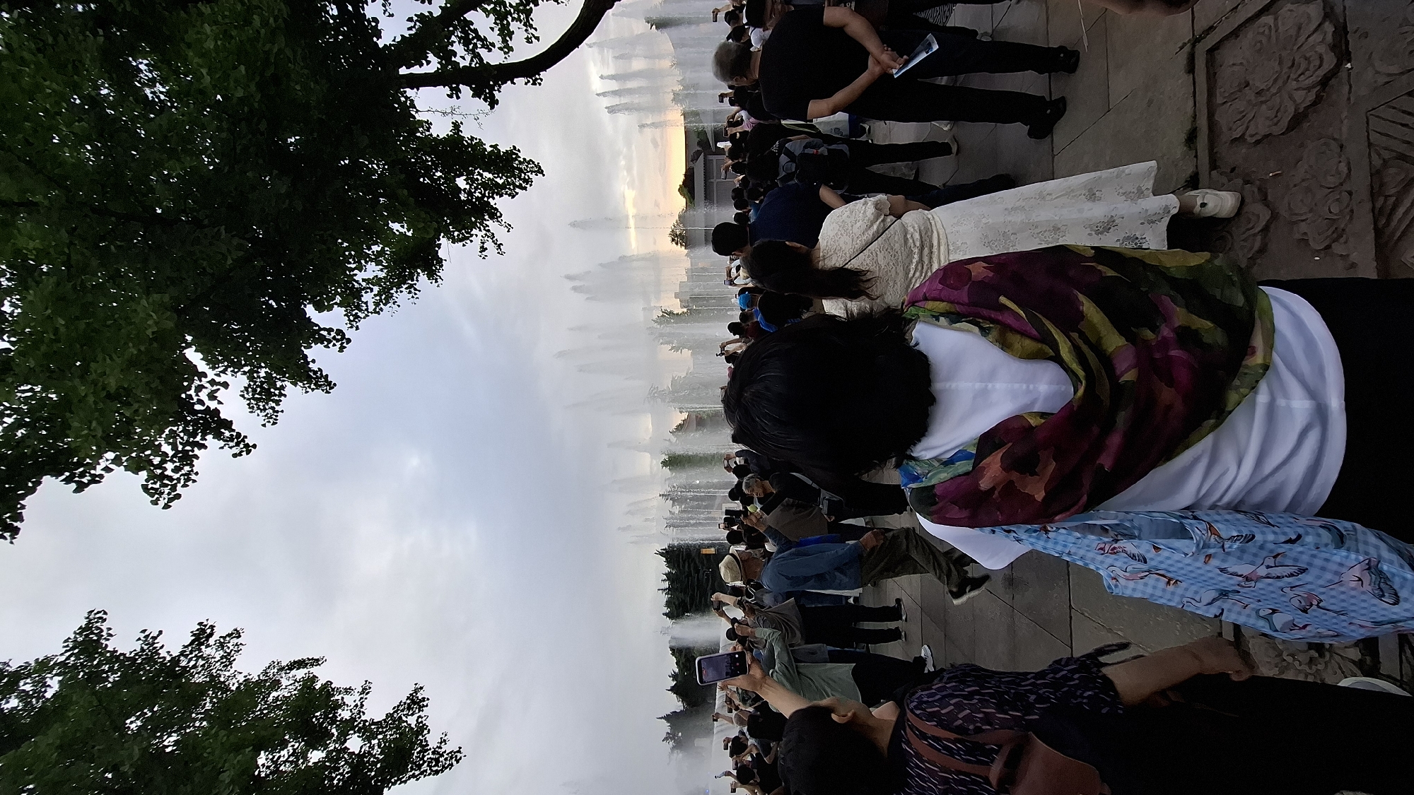 Crowd gathers to photograph water fountain display in Yanta District