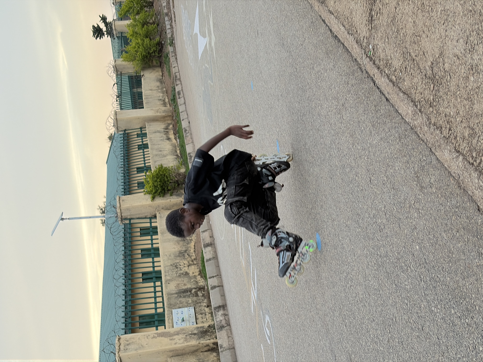 Youth rollerblading and skateboarding captured in Jos, Nigeria