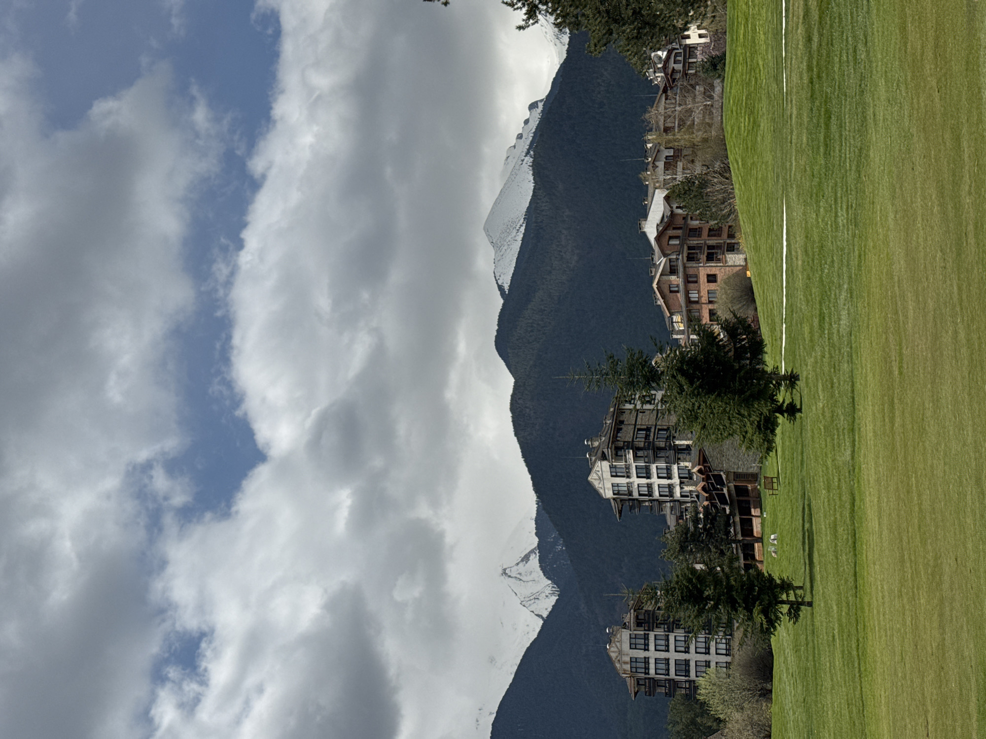 Morning golf game observed in Razlog against snowy mountain backdrop