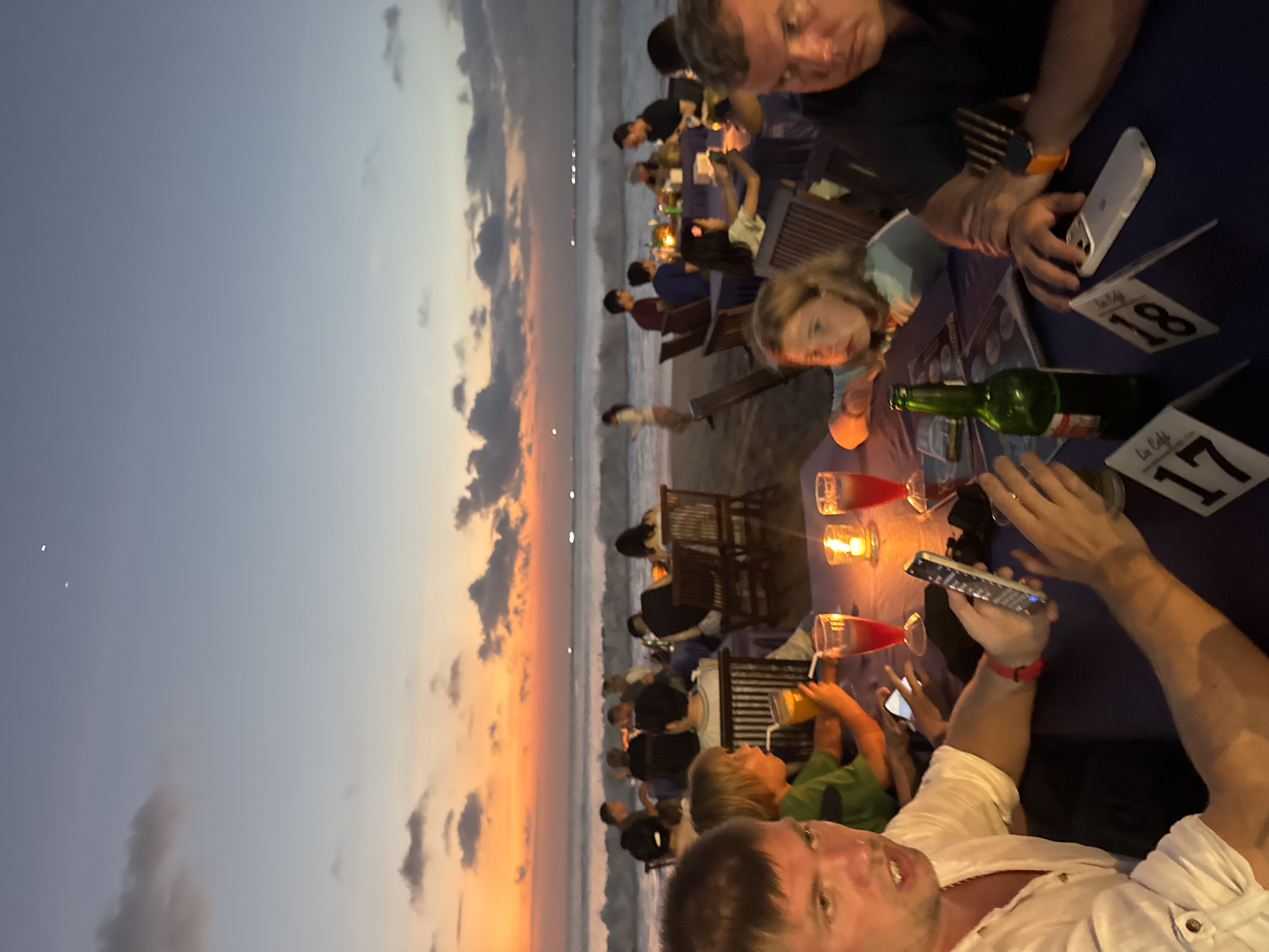 Beachside sunset dining scene unfolds in Kuta Selatan, Indonesia