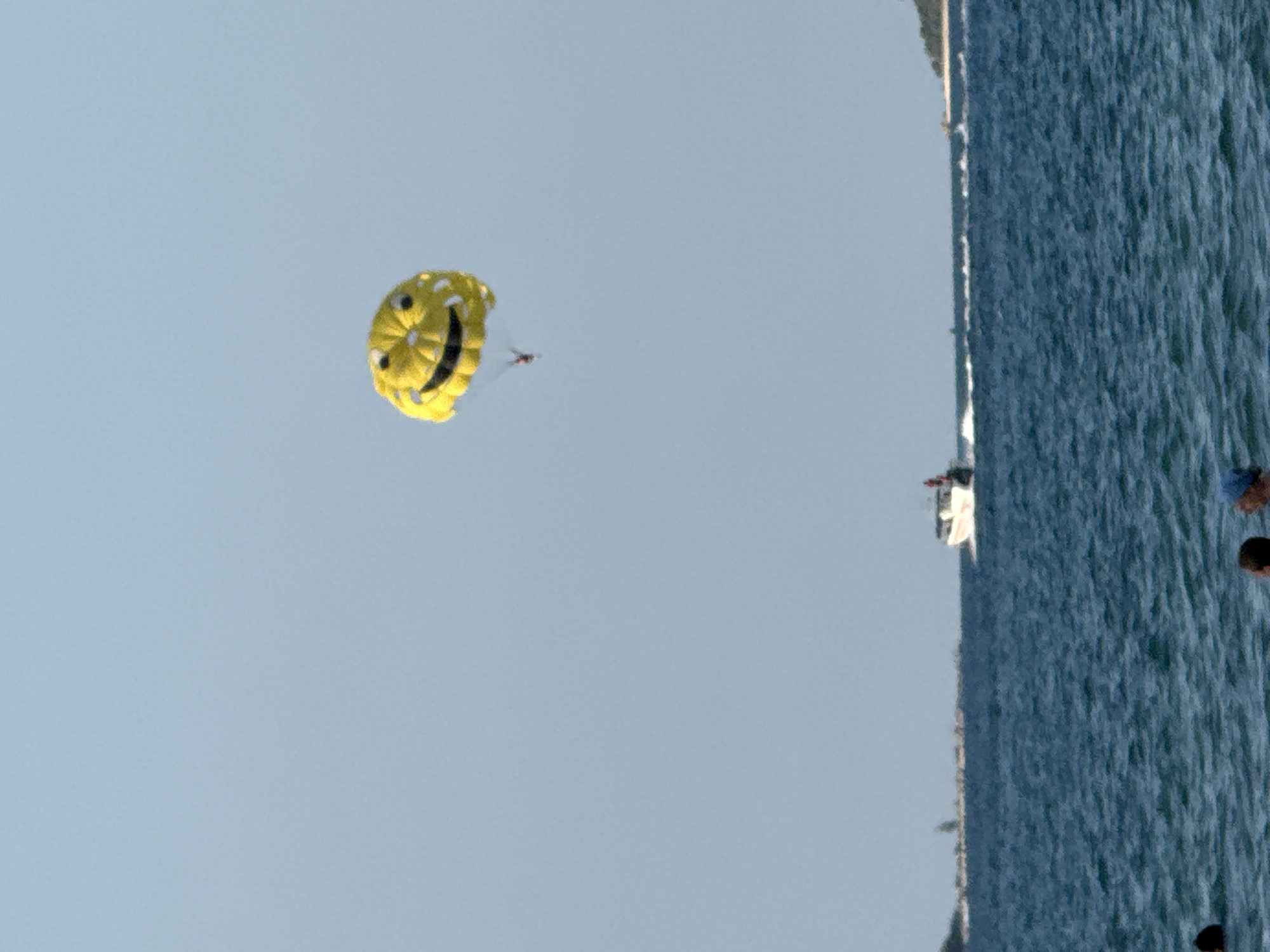 Smiley face parasail over Ko Samui's choppy coastal waters