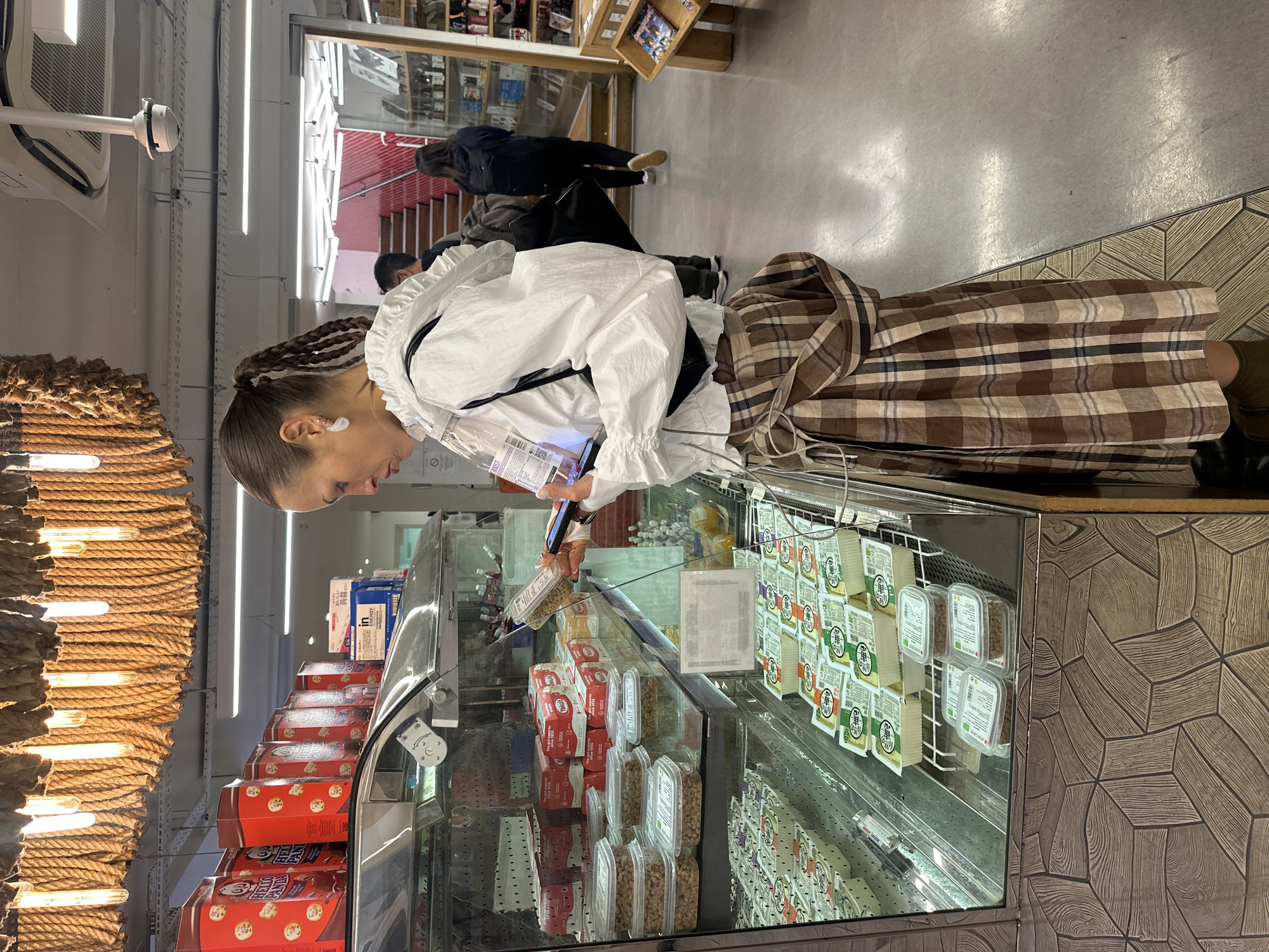 Shopper browses Japanese specialty items at London grocery store