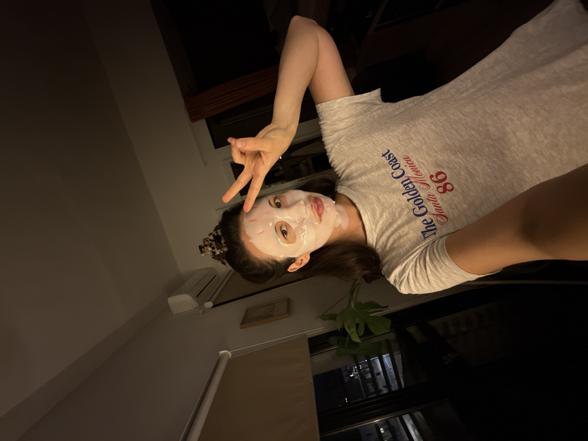 Woman takes selfie with face mask in Tel Aviv