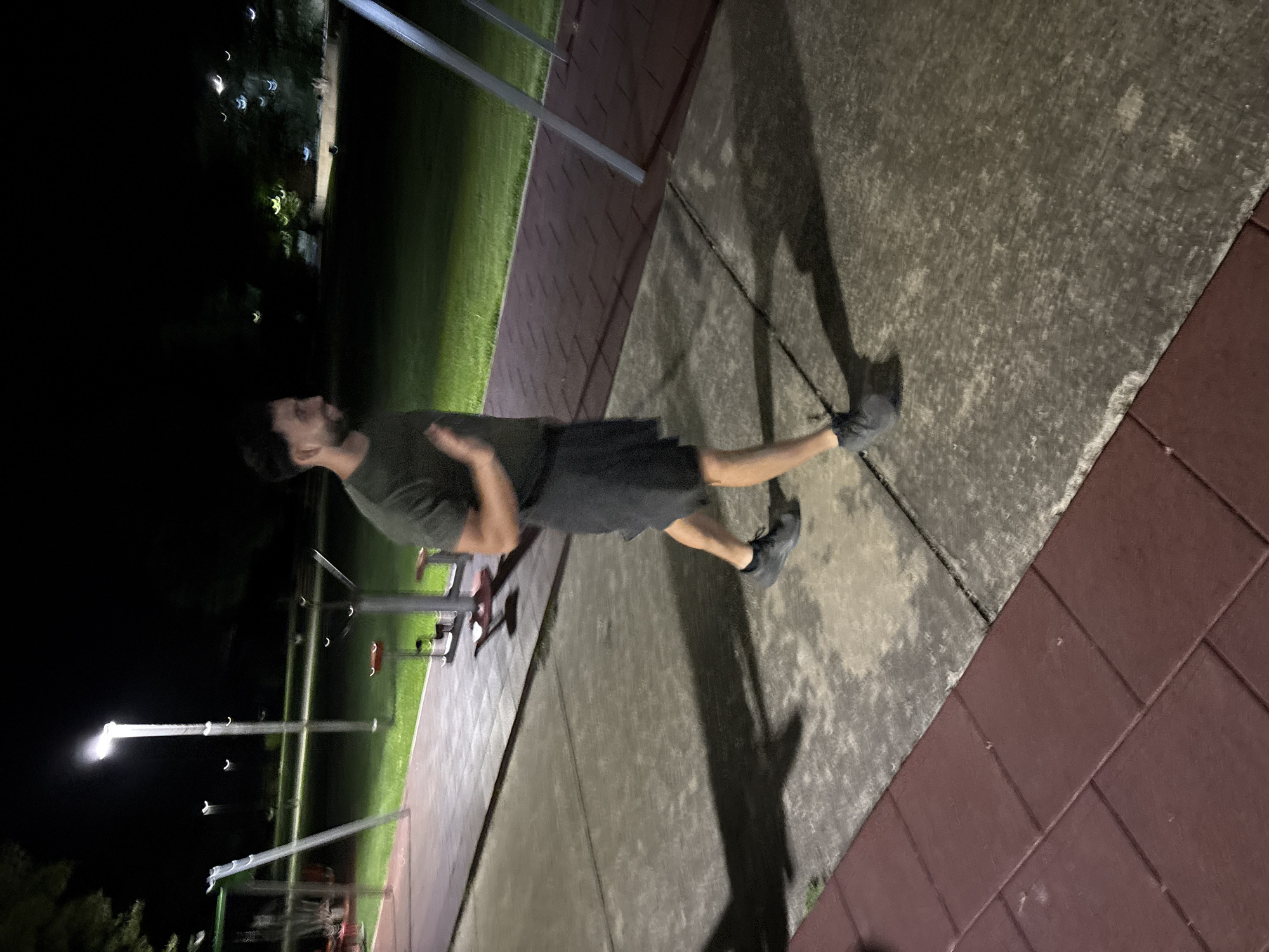Man exercises at outdoor fitness park in Dobrich, Bulgaria