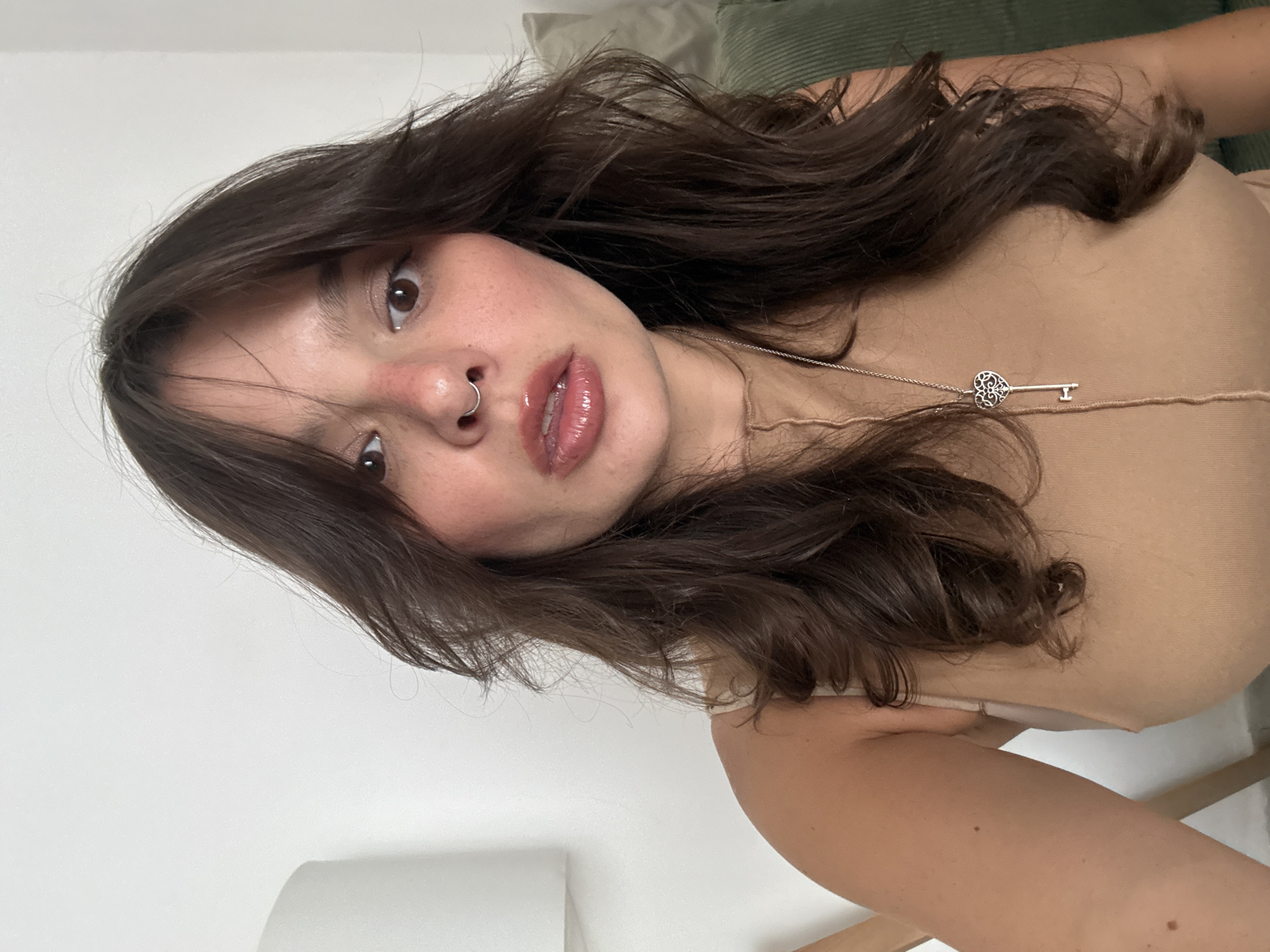 Woman takes multiple selfies indoors in Tel Aviv
