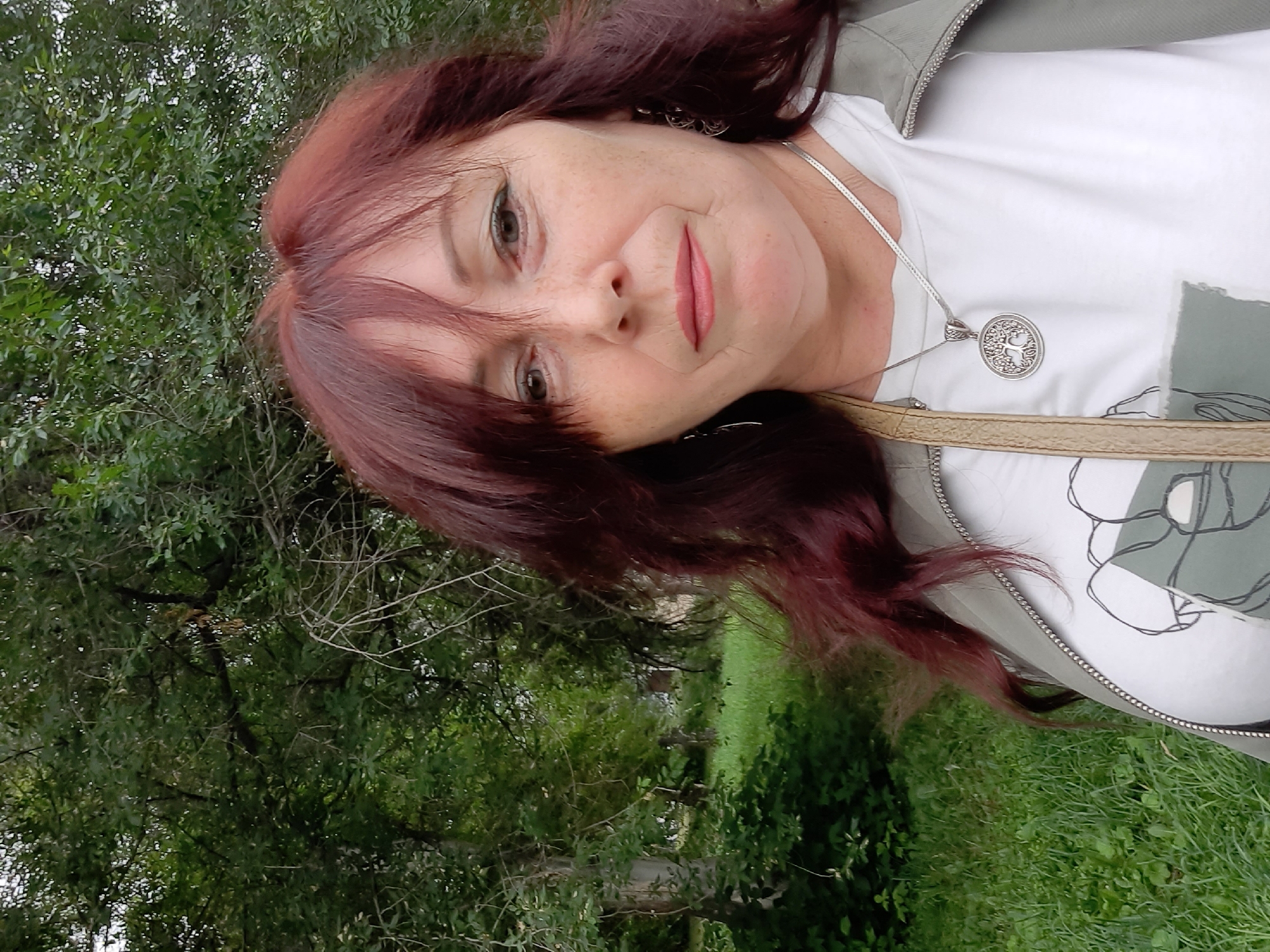 Outdoor portrait session in a green Kemerovo setting