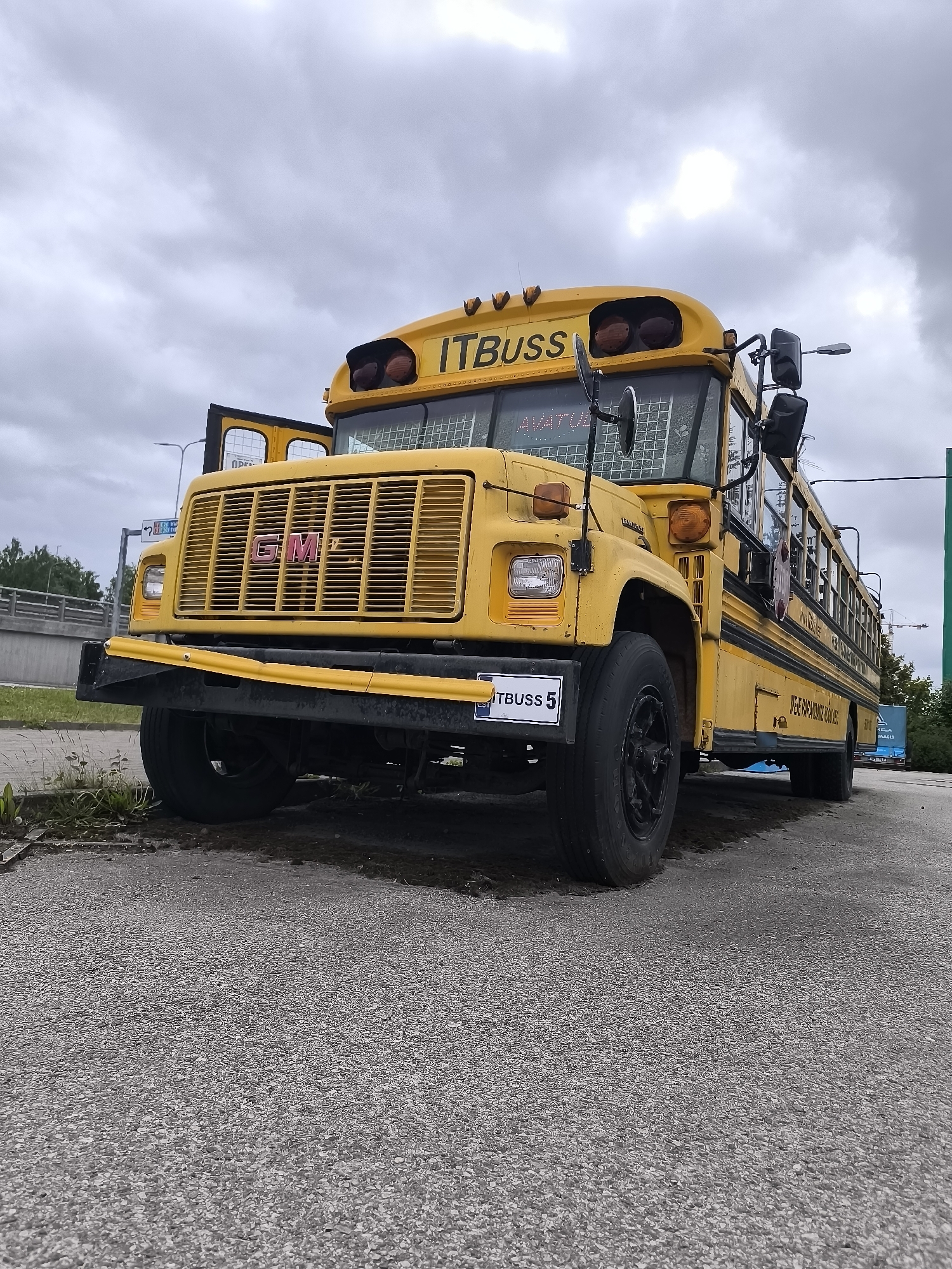 American school bus spotted in Tallinn amid spring blooms