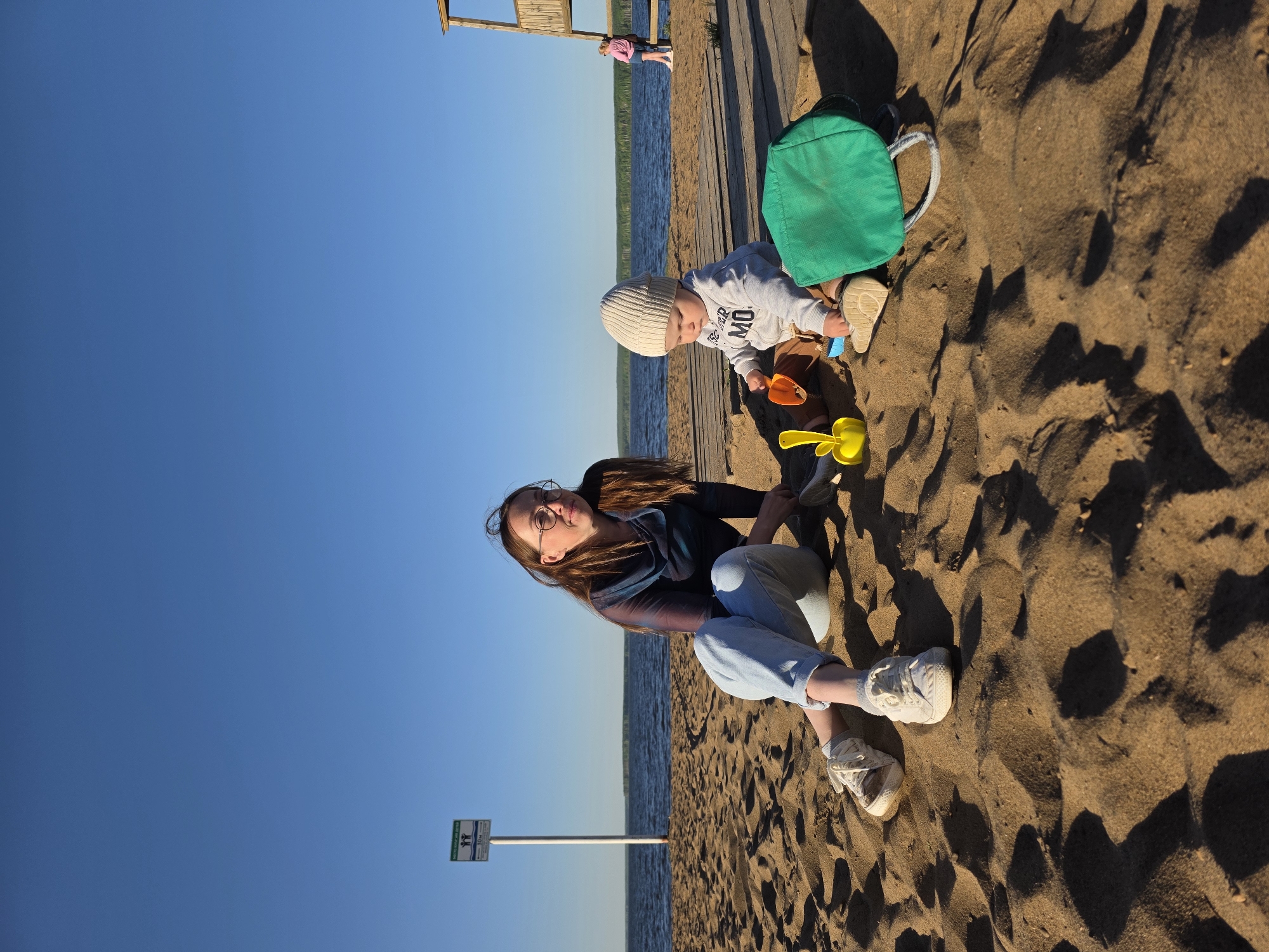 Mother and toddler enjoy beach afternoon in Chaikovsky, Russia