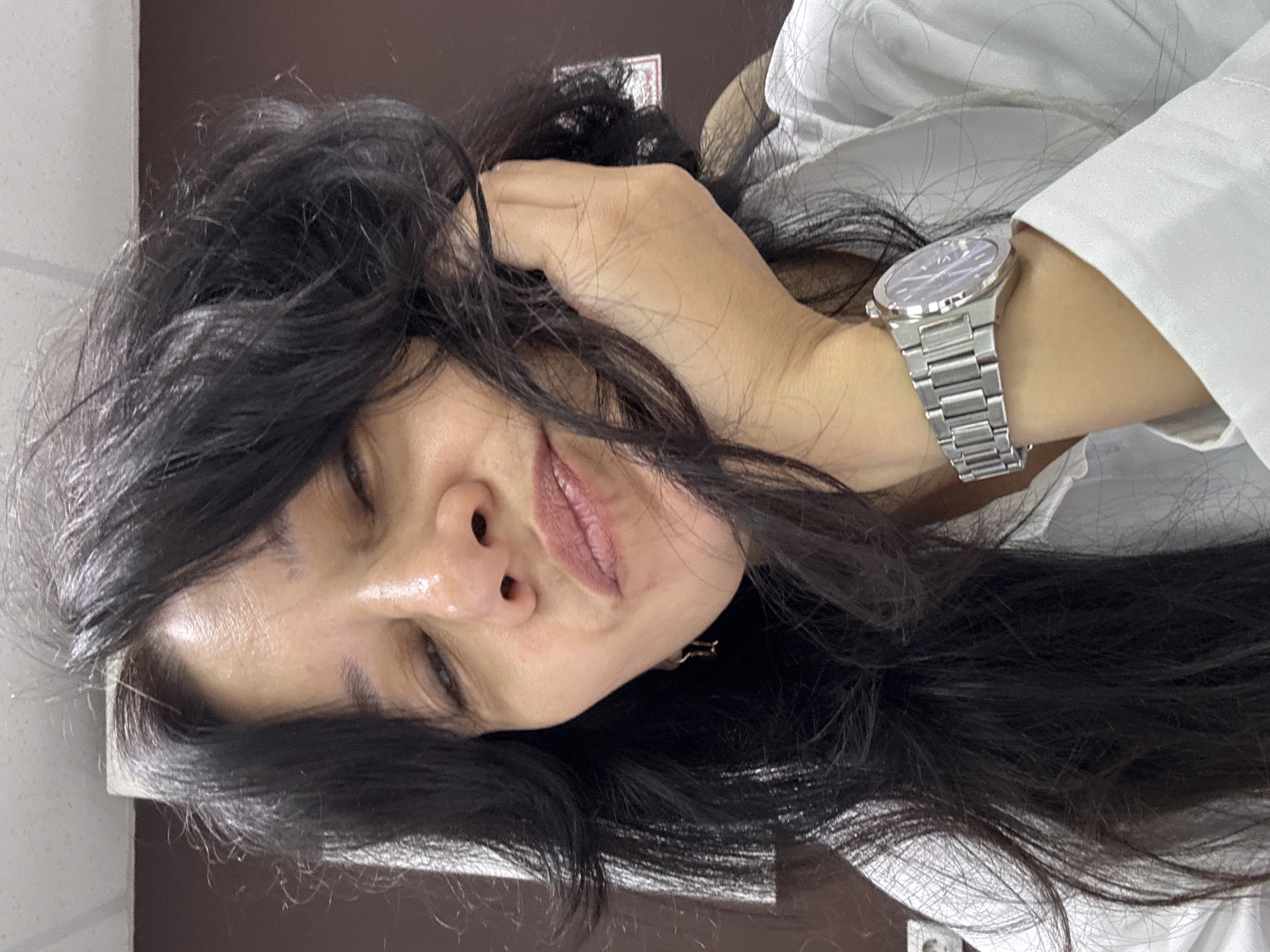 Casual selfie against a brown wall in Chaikovsky, Russia
