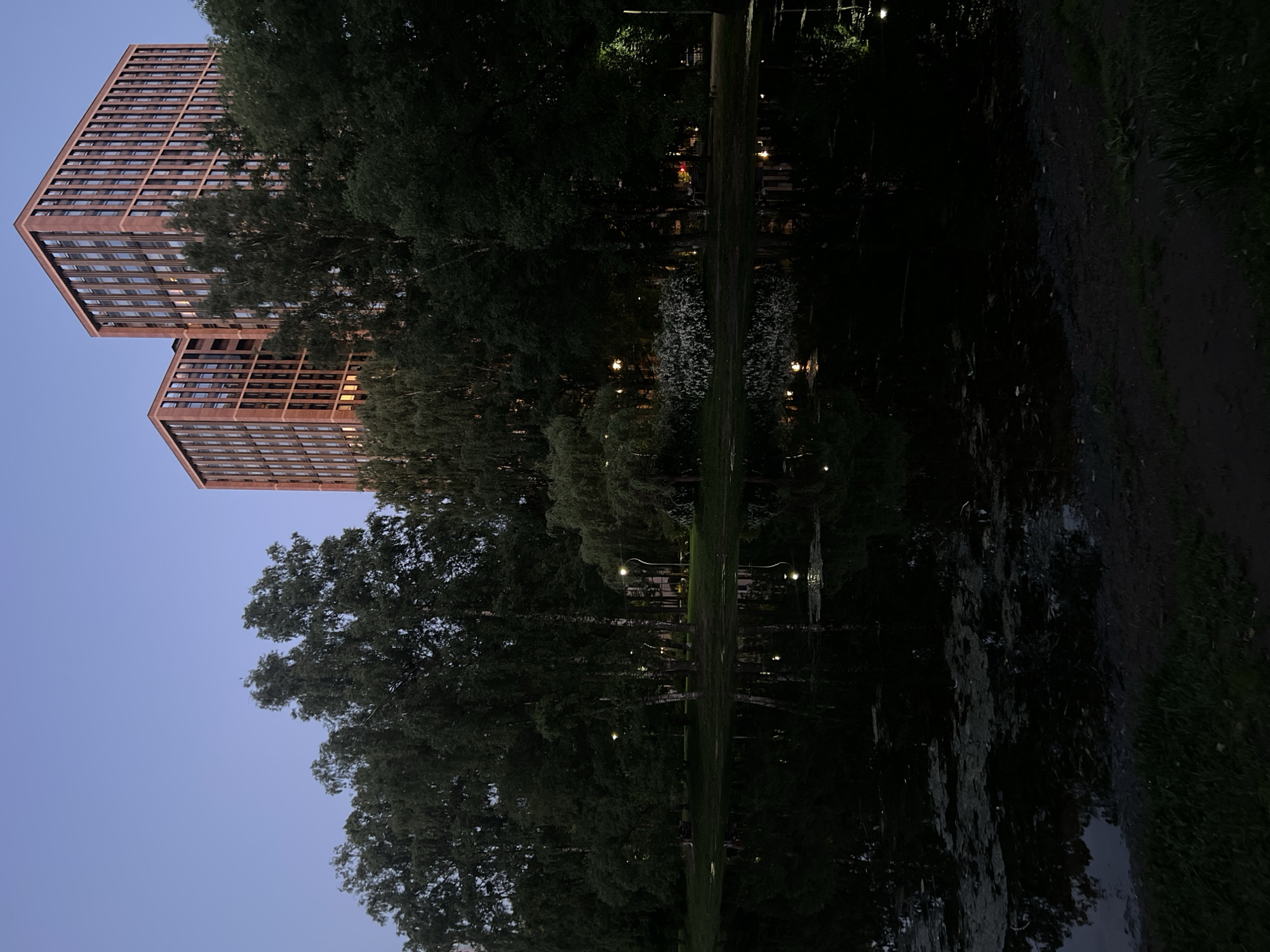 Evening park walk documented in Russian urban district