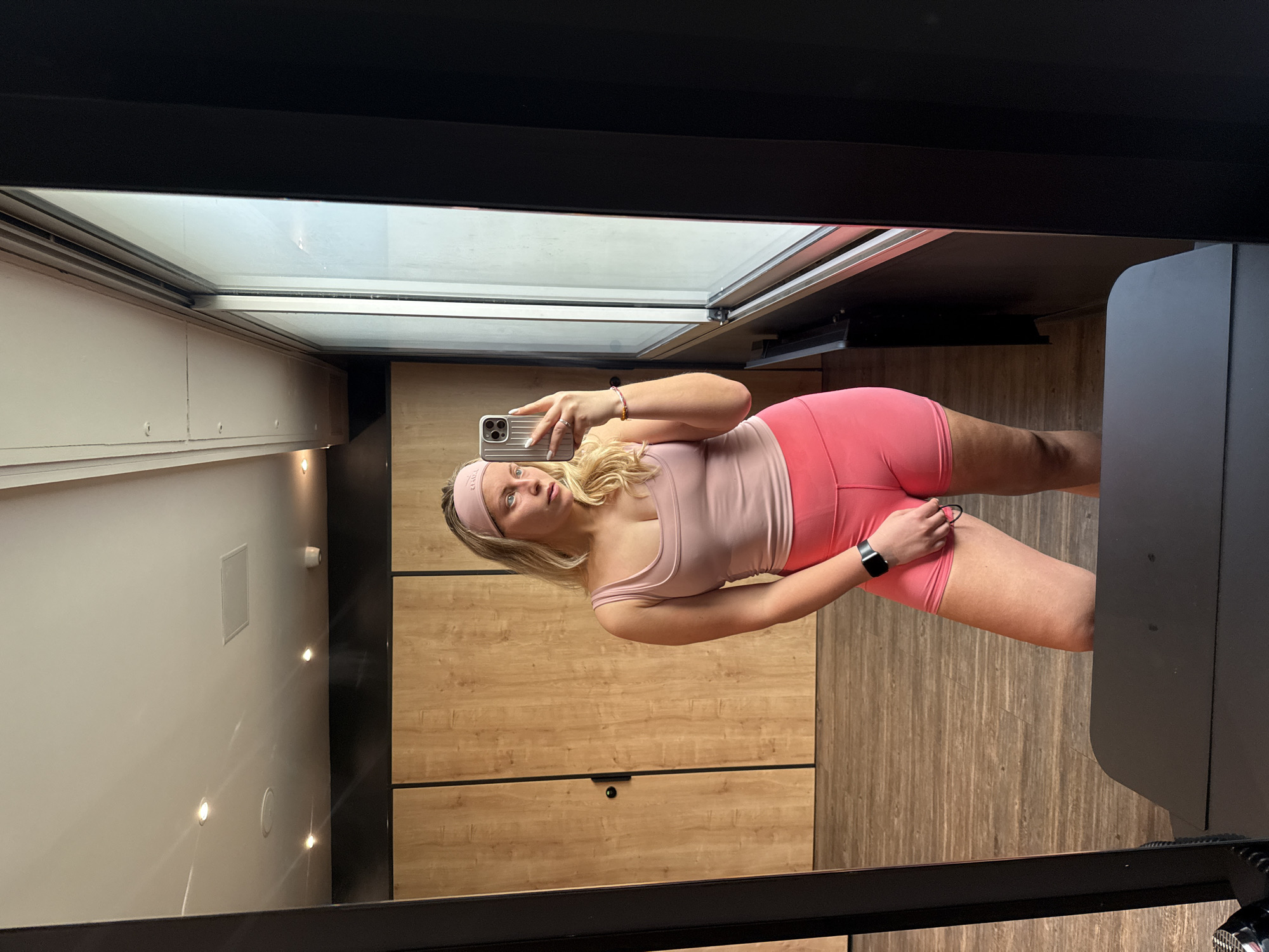 Woman takes mirror selfies in Paris locker room