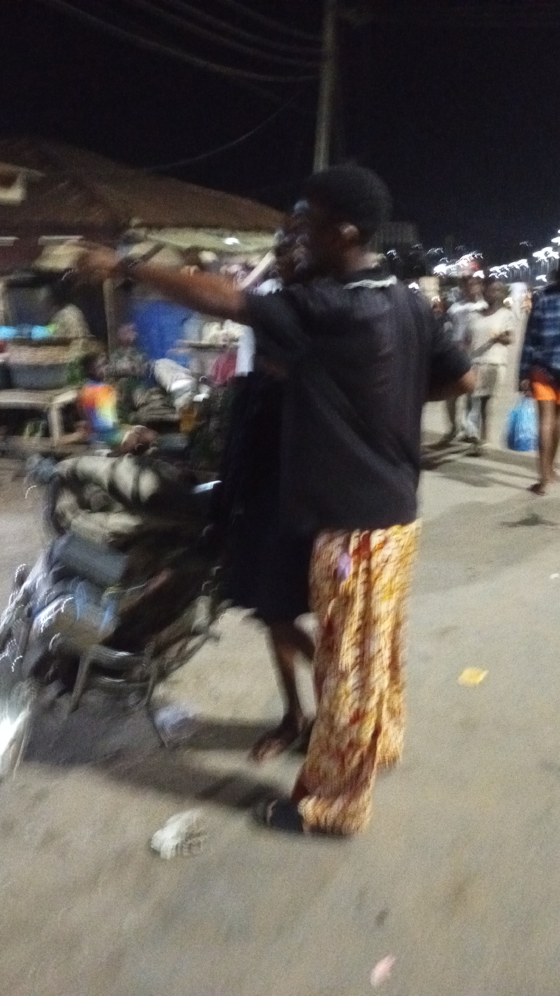 Nigerian communities document typical evening street life and commerce