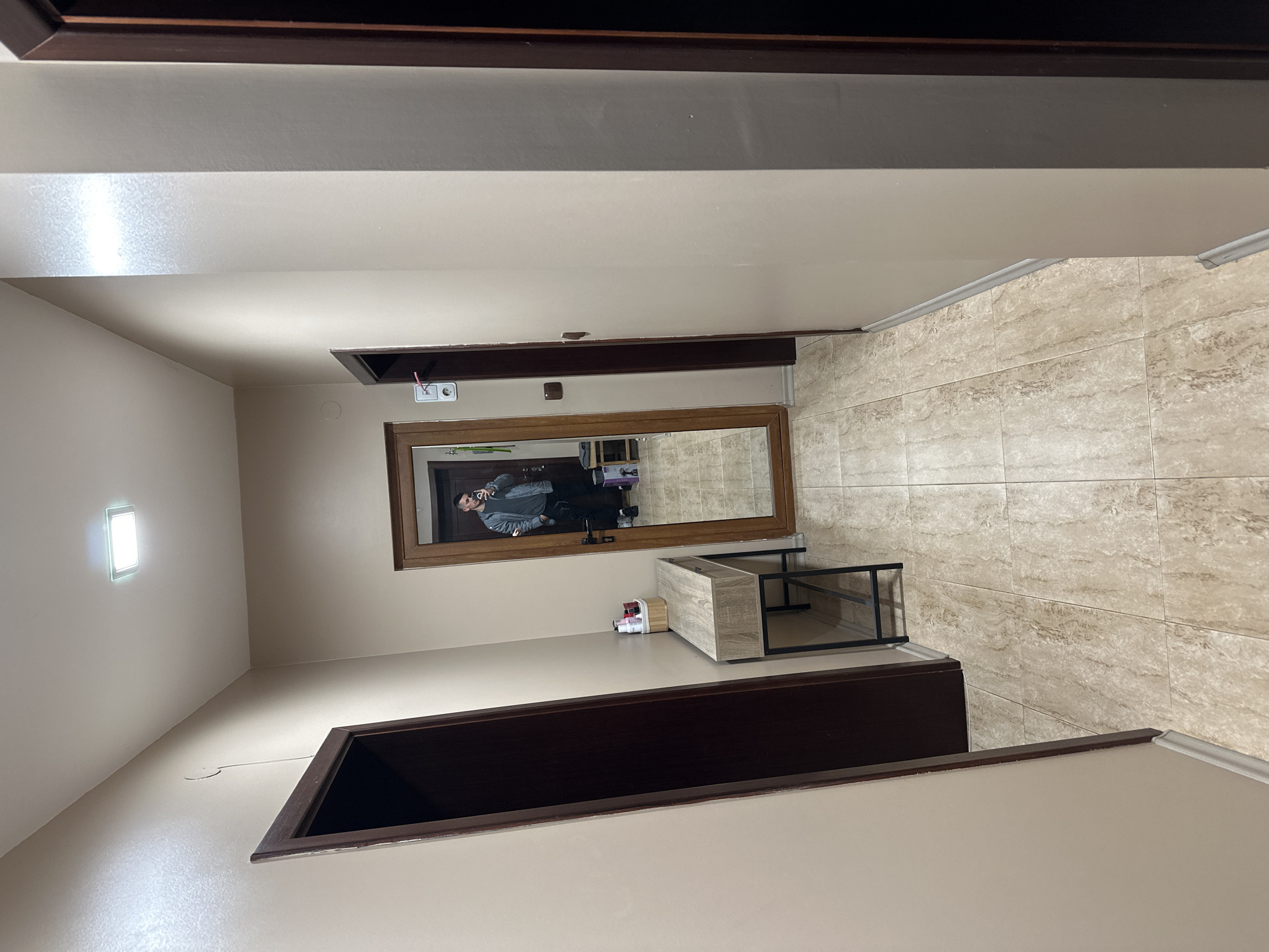 Person takes mirror selfie in Blagoevgrad building interior