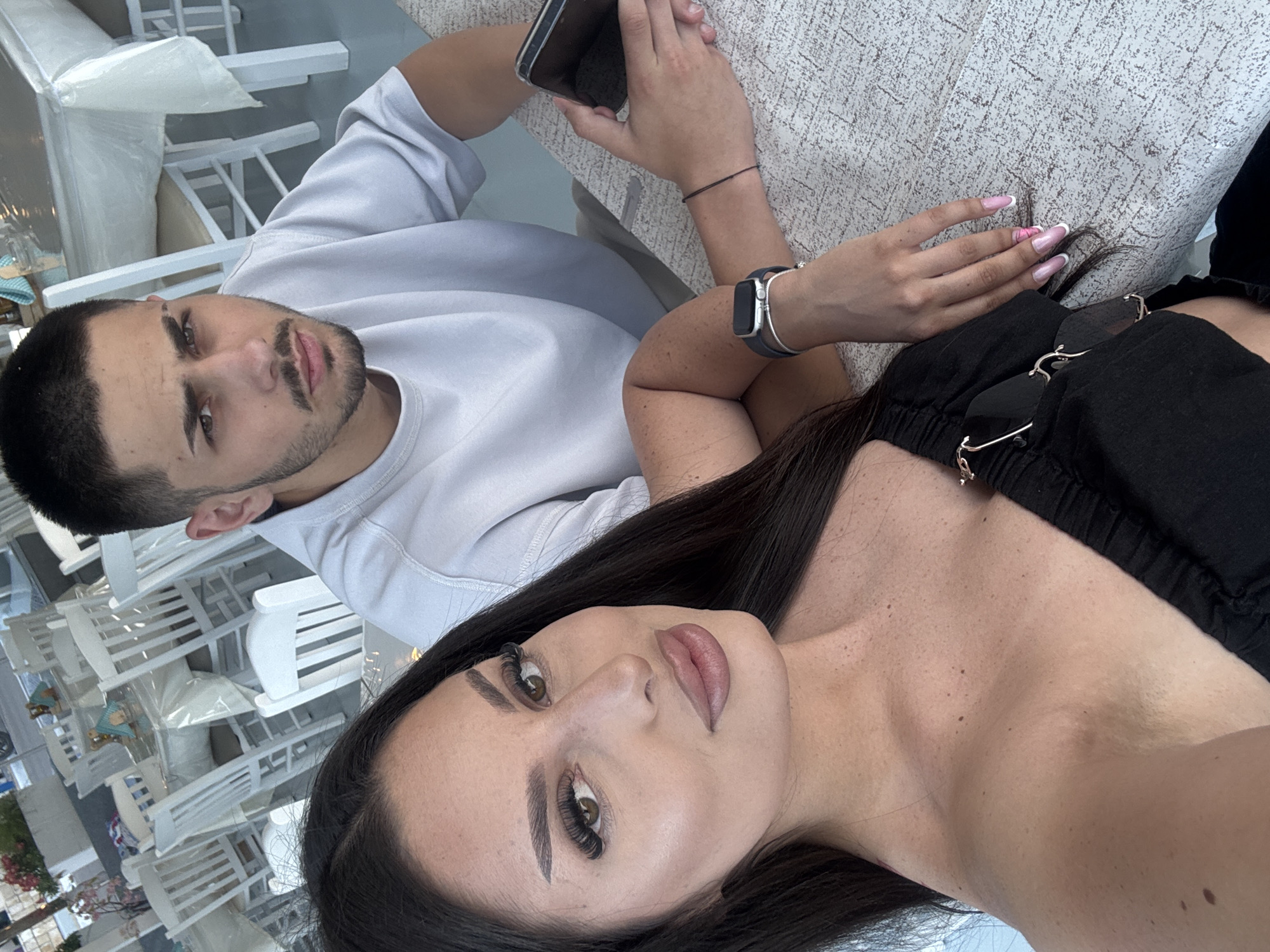 Couple documents dining and beach visit in Apollonioi, Greece
