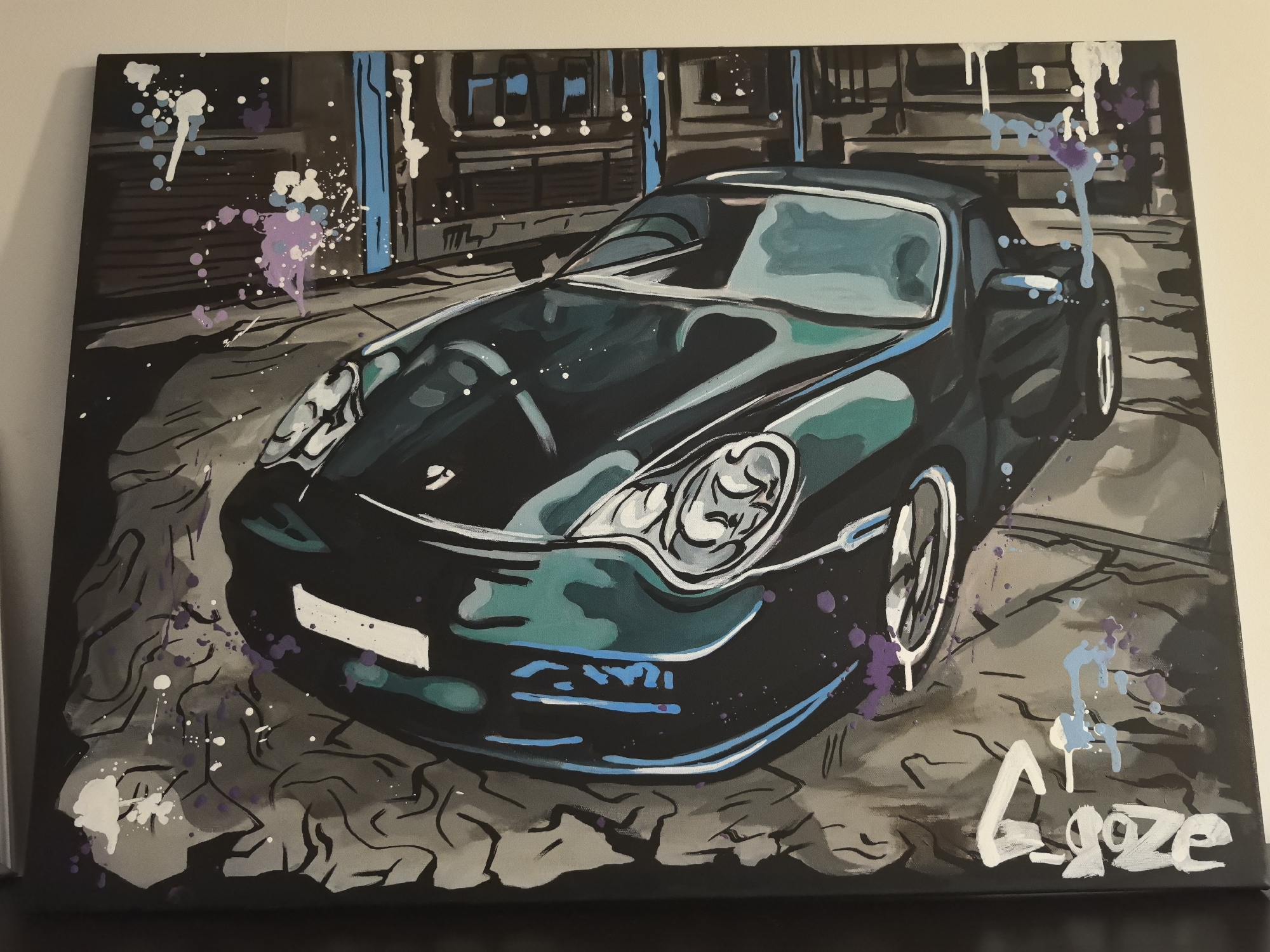 Graffiti Porsche painting and a tabby cat on hardwood
