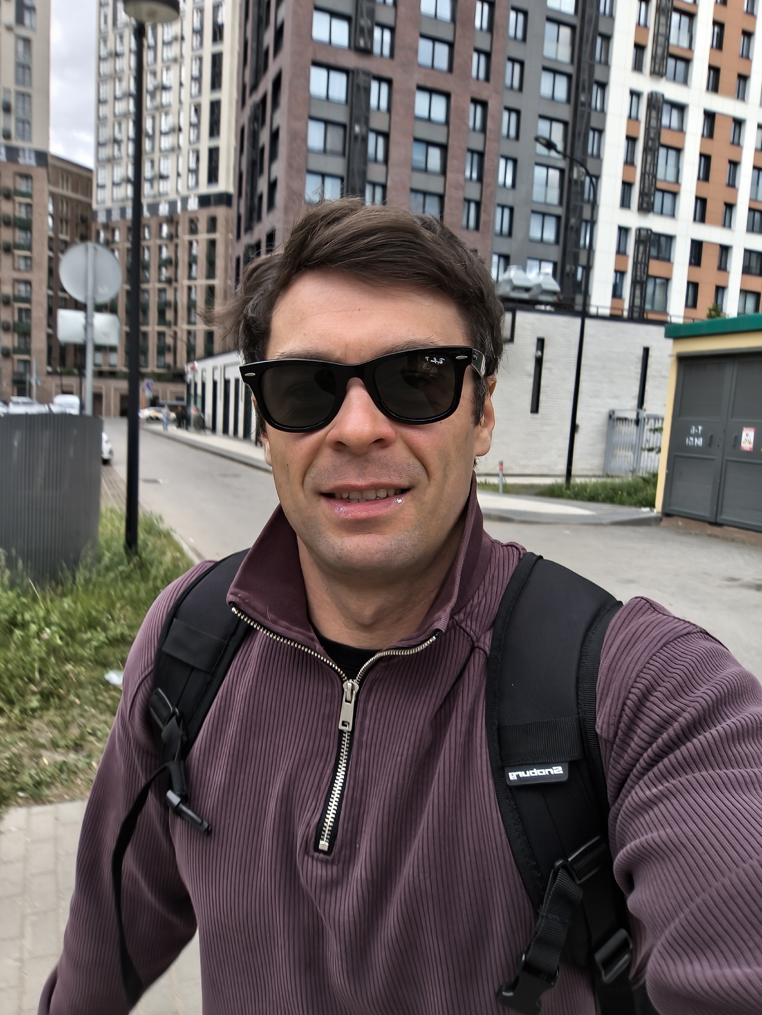 Man in purple shirt moves through Moscow locations