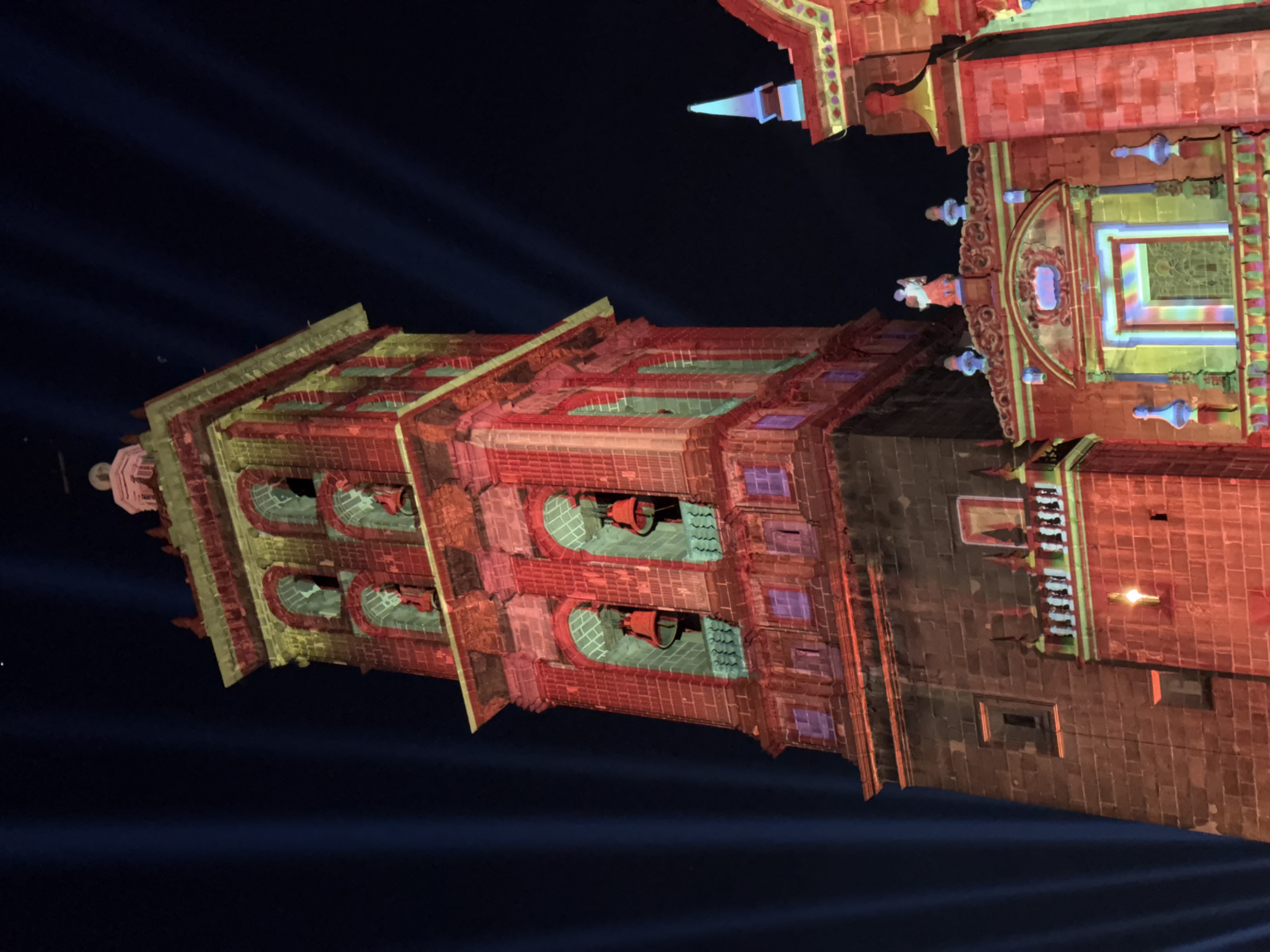 Church in Puebla illuminated with colorful lights at night