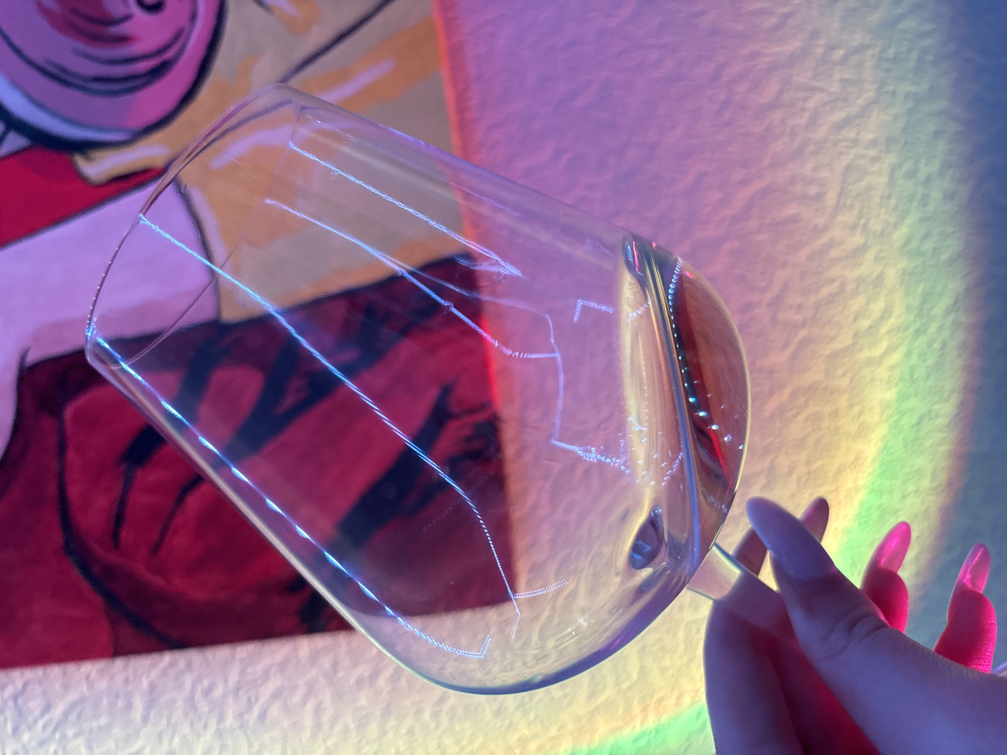 Wine glass and pink camera captured in Russian location