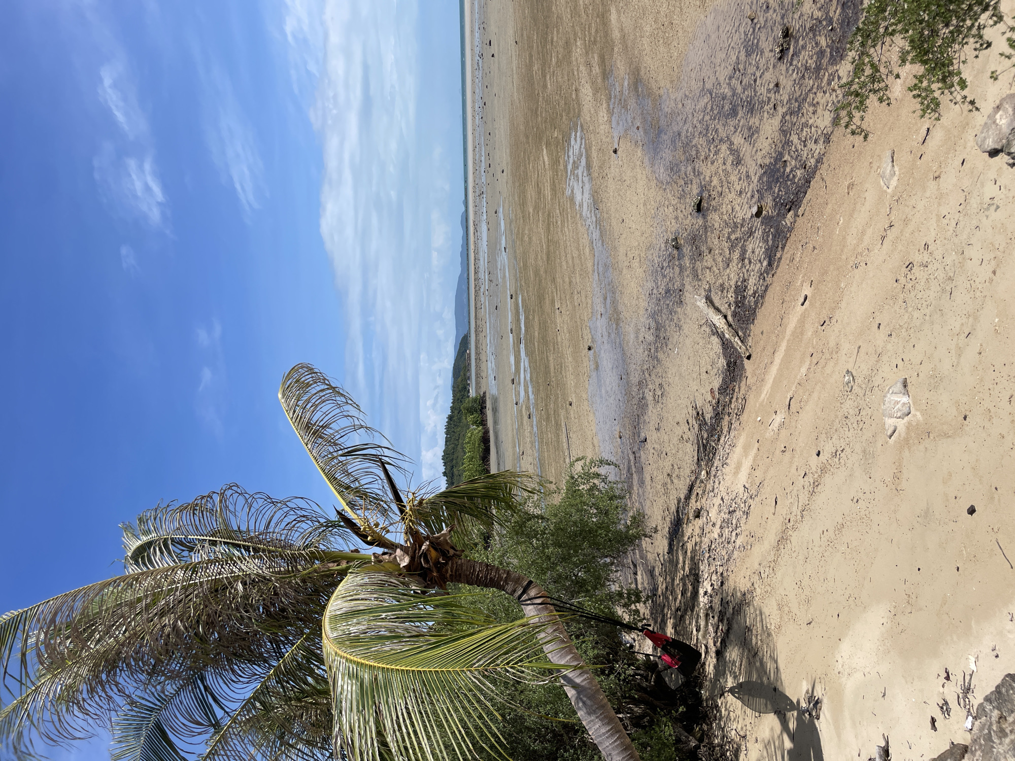 Low tide exposes wide sand flats at Thai beach