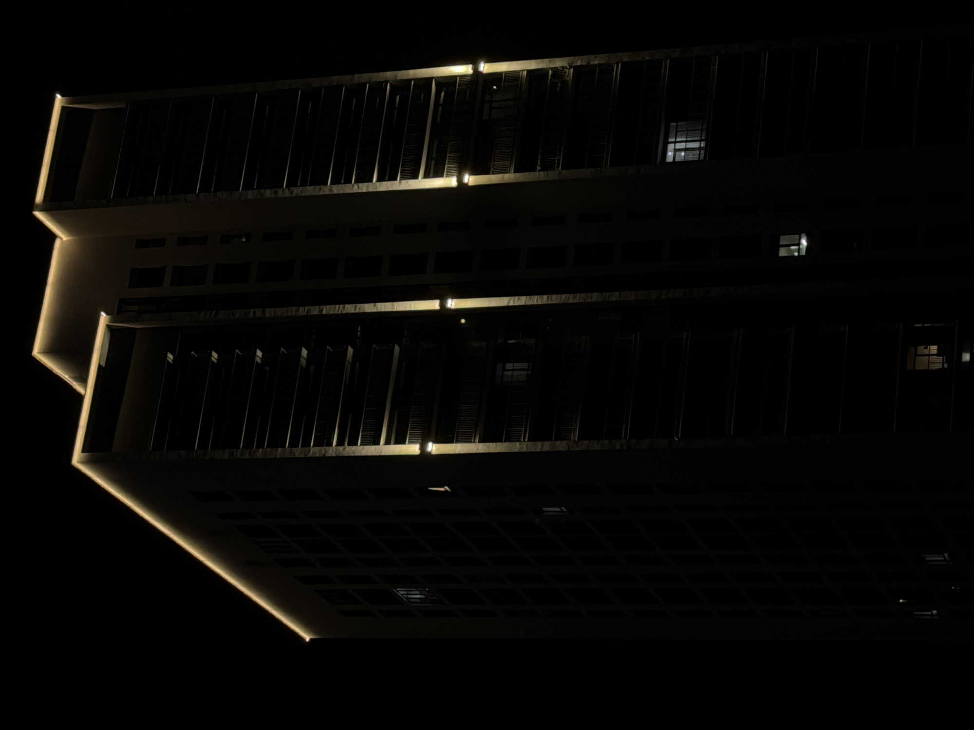 Modern Yekaterinburg building lit up at night