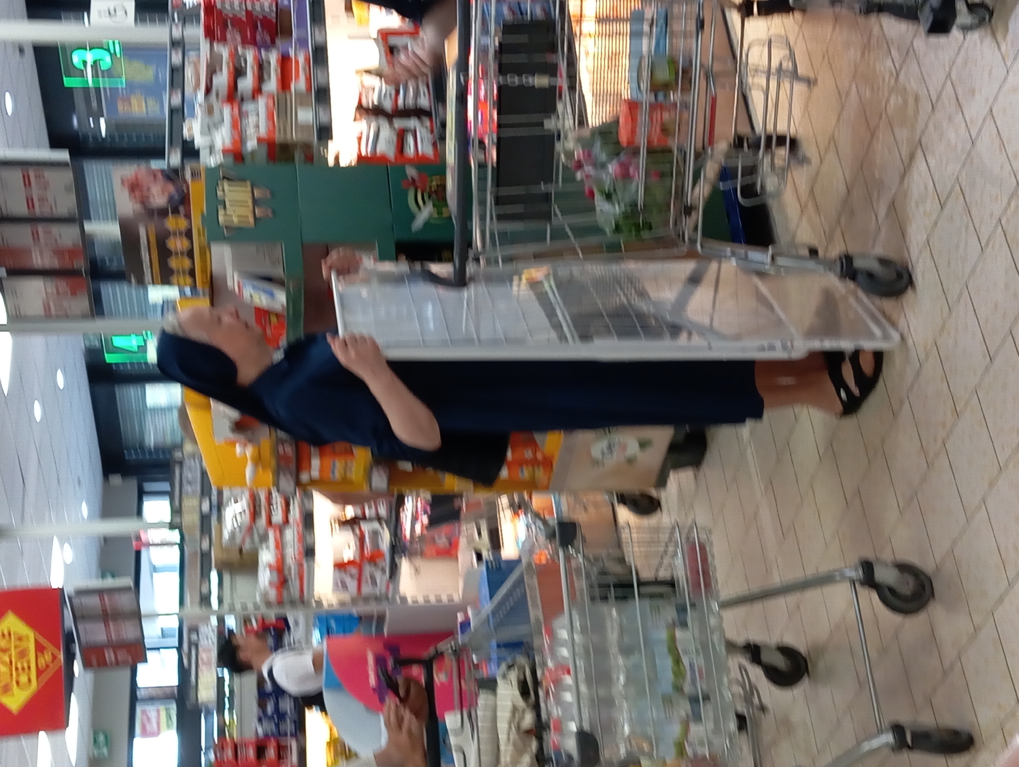 Nun grocery shopping in a Nitra supermarket aisle