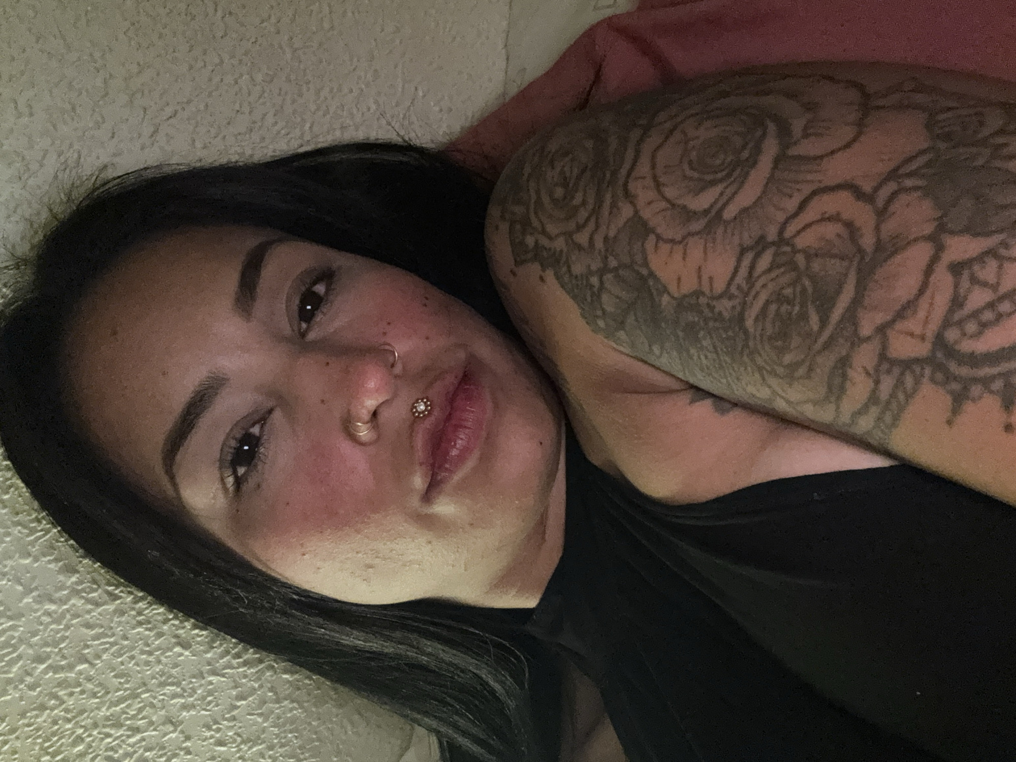 Woman with tattoos and piercings resting in Murcia