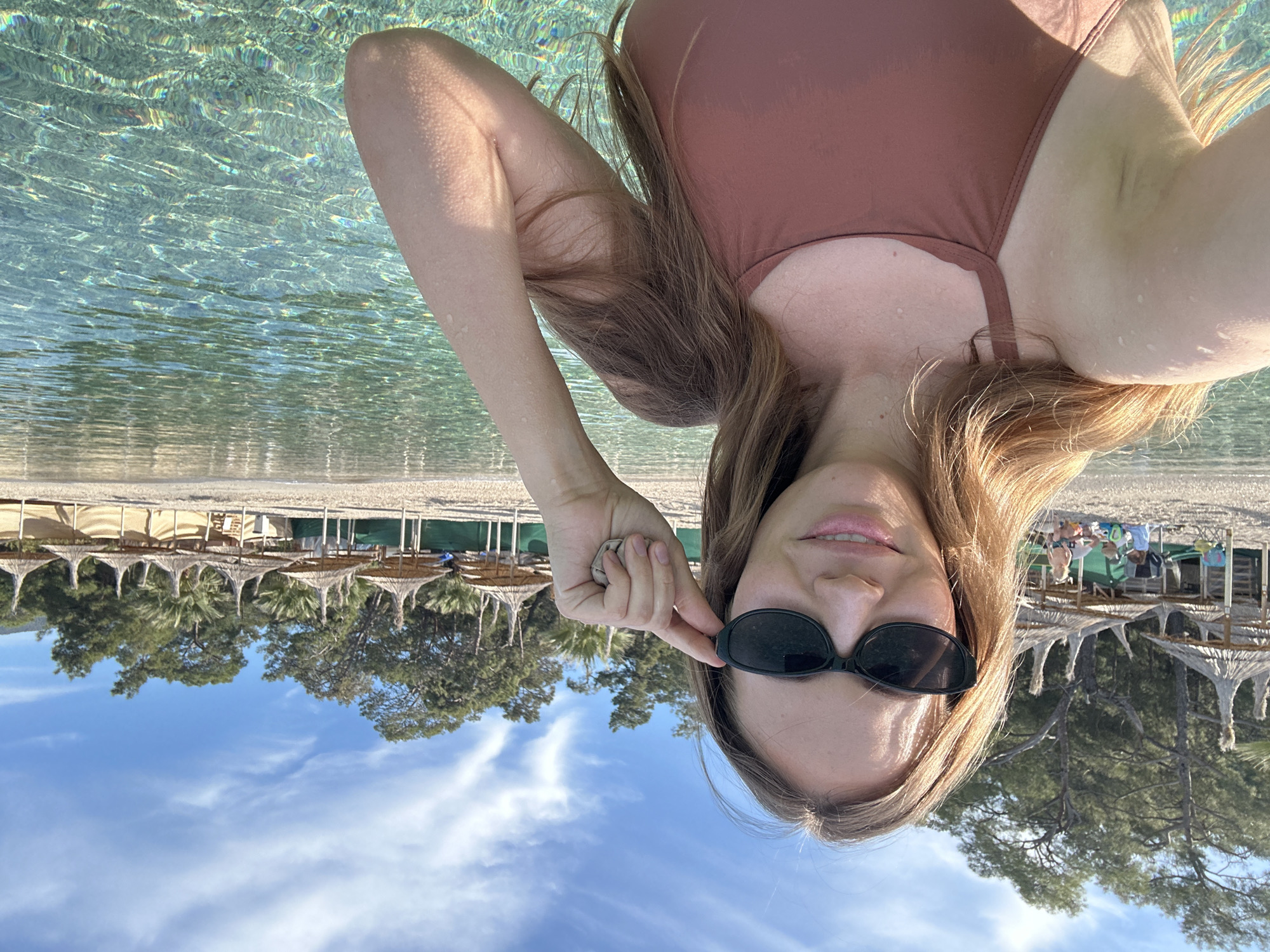 Woman takes swimming selfie at Fethiye beach