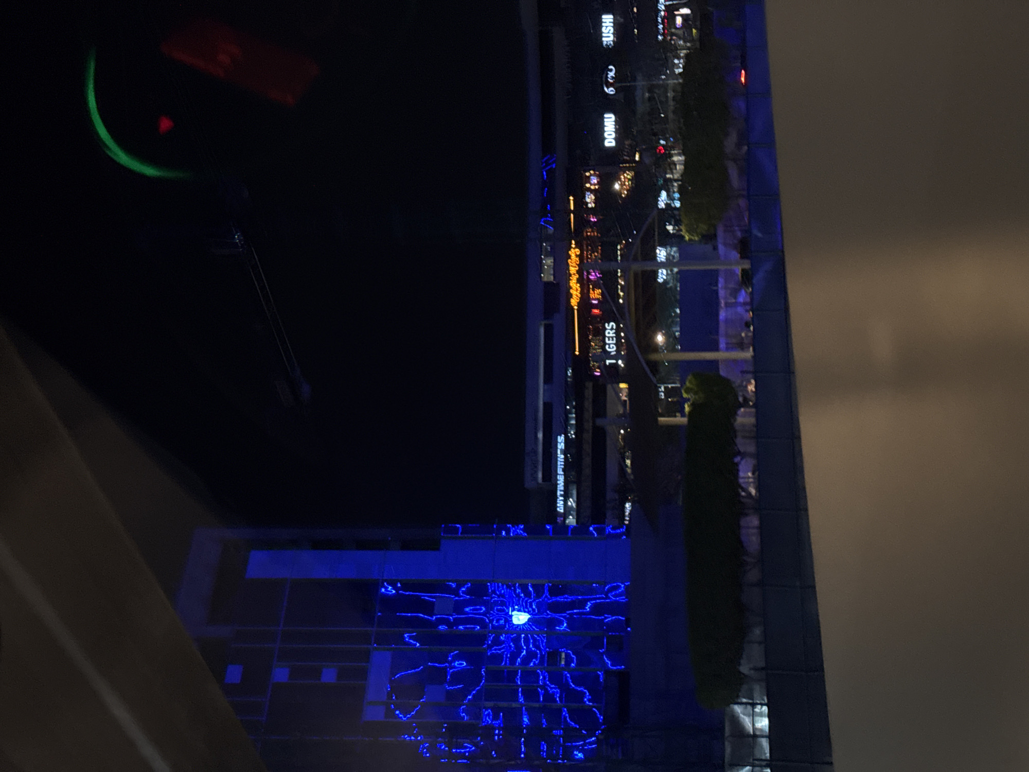 Nighttime commercial district illuminated in Puebla, Mexico