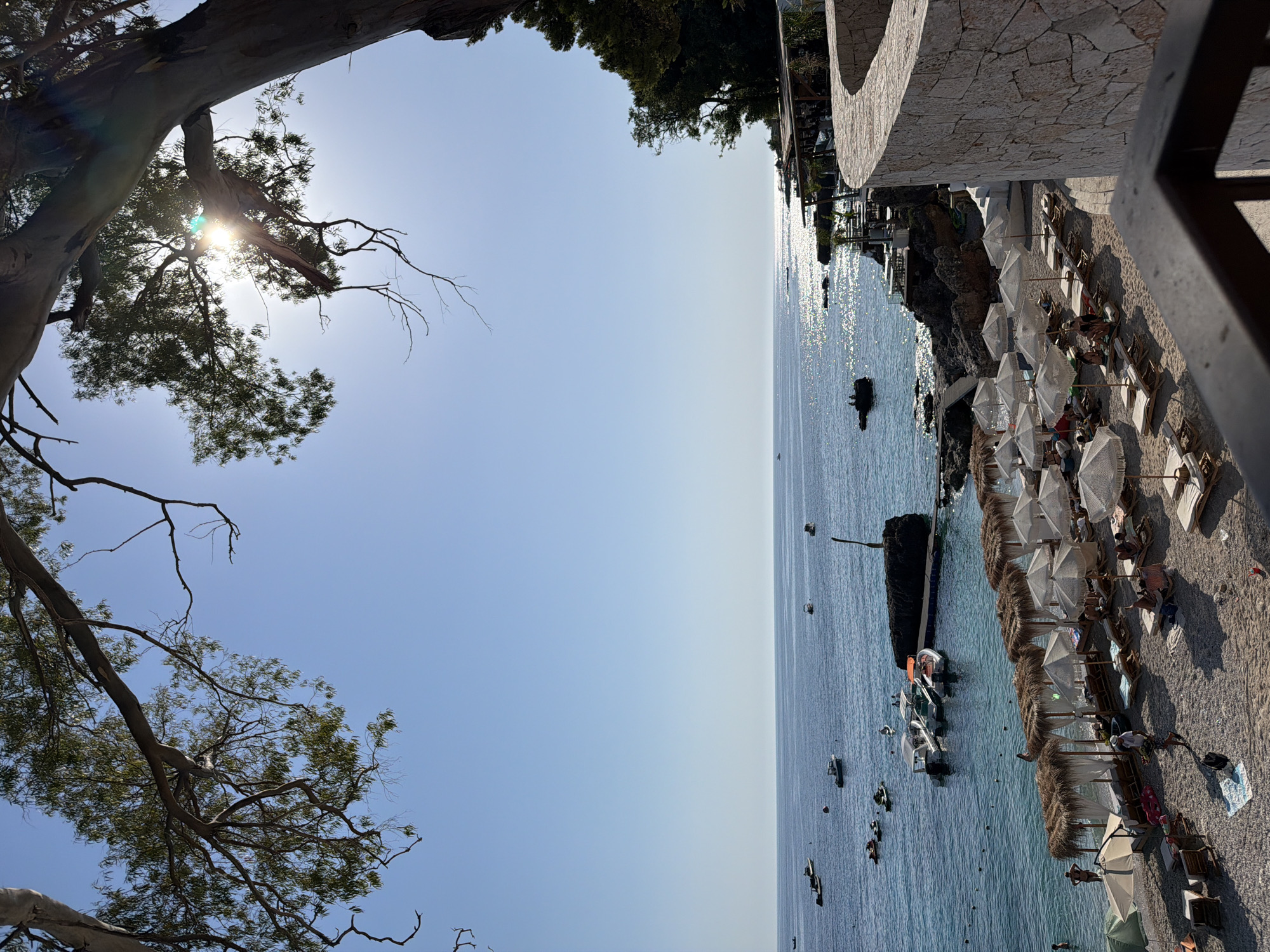 Himarë's waterfront buzzing on a summer afternoon