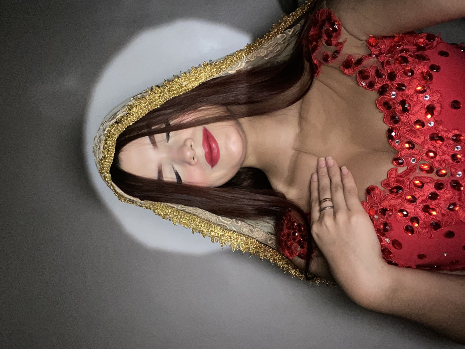 Woman poses for portrait session in traditional dress in Venezuela