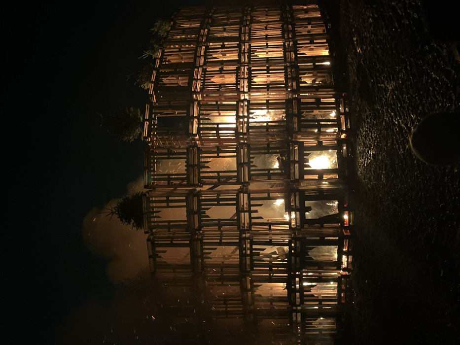 Torchlight ceremony features massive wooden pallet bonfire in Luxembourg