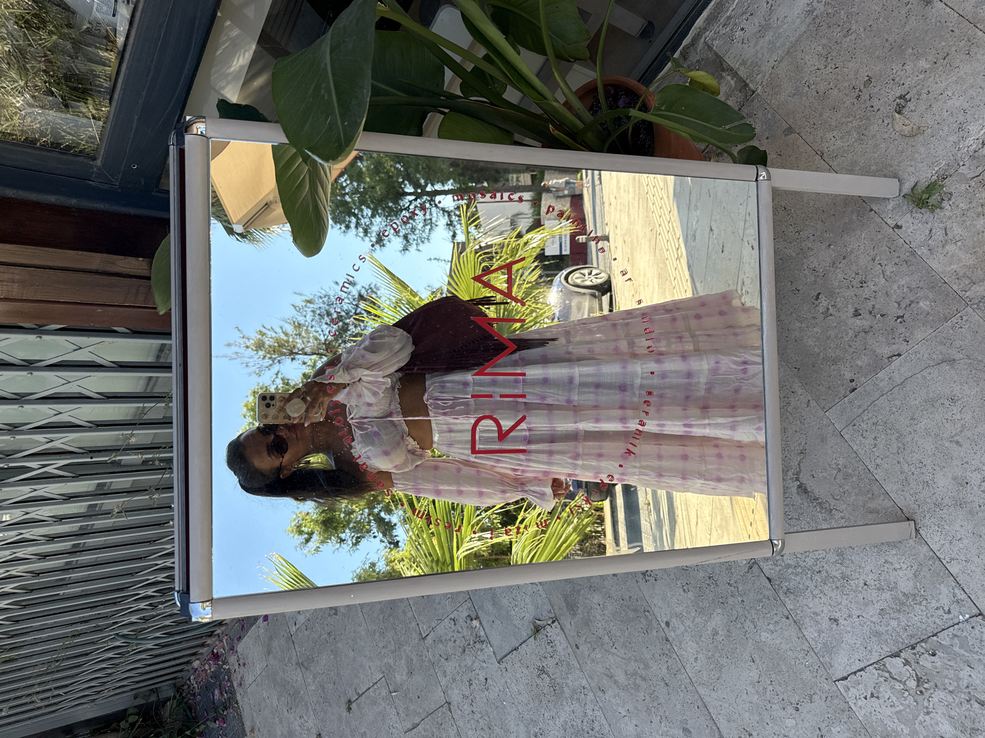 Woman documents selfie session amid bougainvillea in Bodrum, Turkey