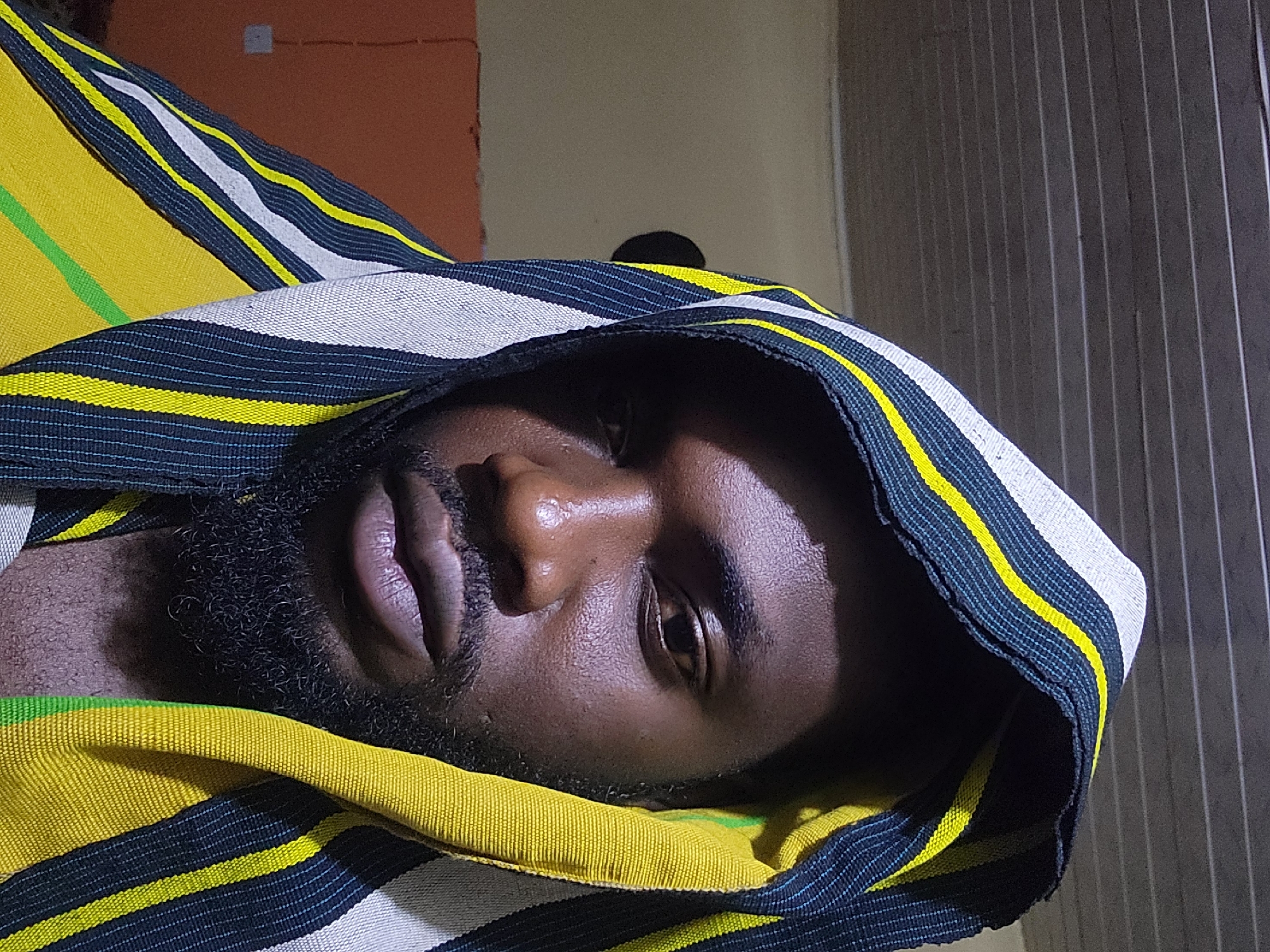Striped beanie, Maltina, and selfies in Jos