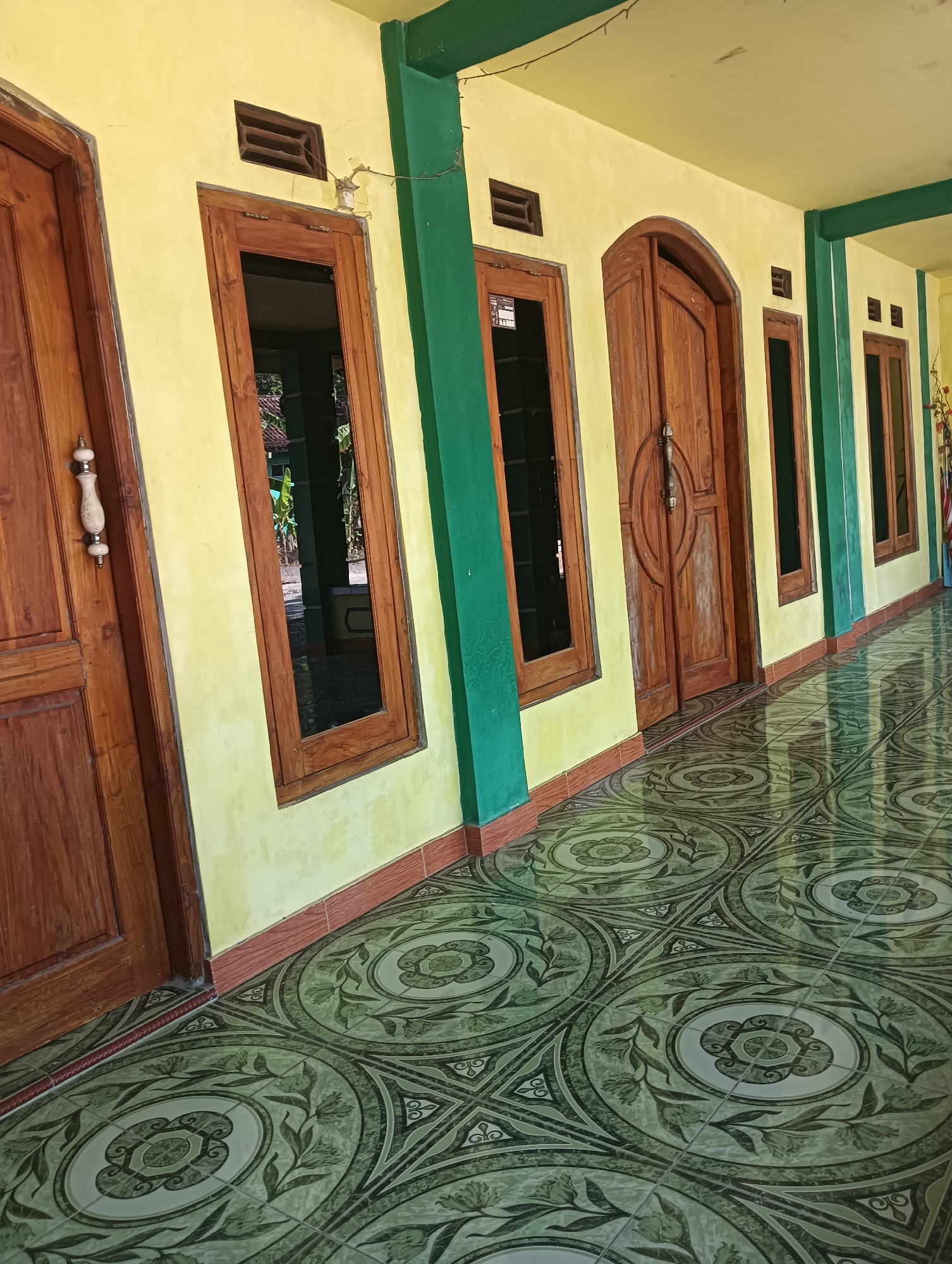 Village life in Tanggan: birdcages, doves, and colorful architecture