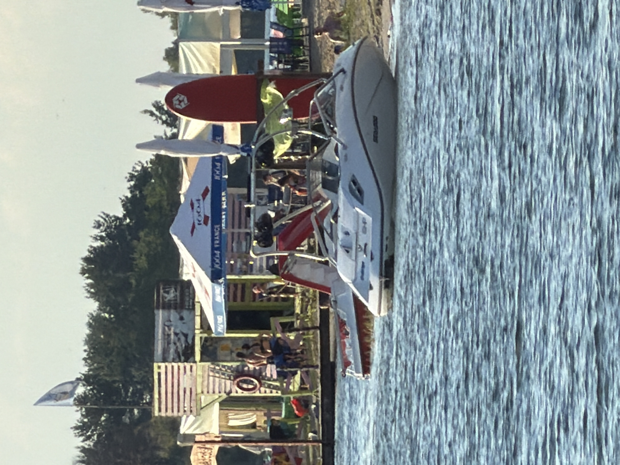 Summer lake afternoon: jet skis, paddleboards, and golden hour