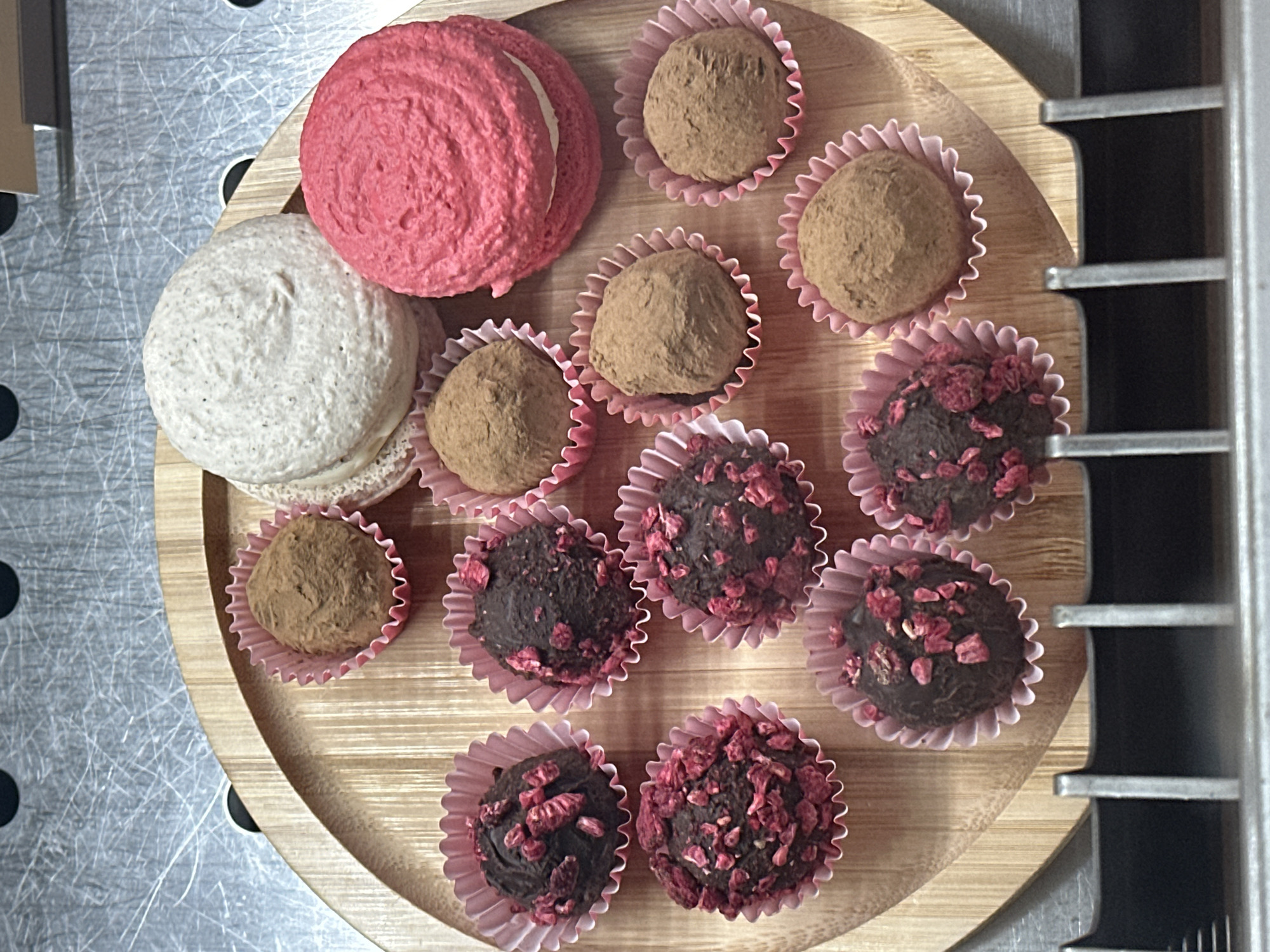 Confectionery display photographed on wooden tray in Novi Sad