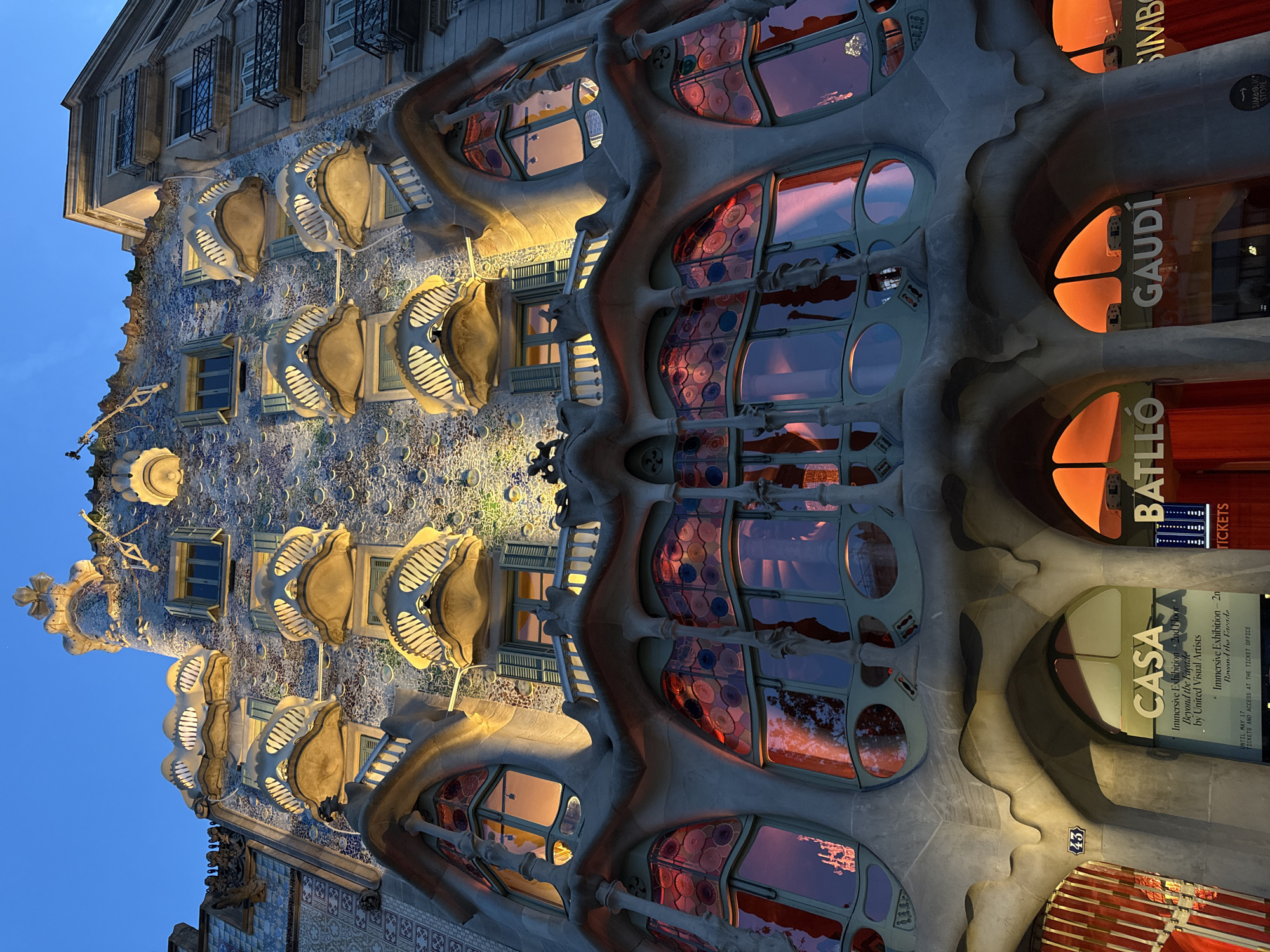 Evening documentation of Gaudí's Casa Batlló facade in Barcelona