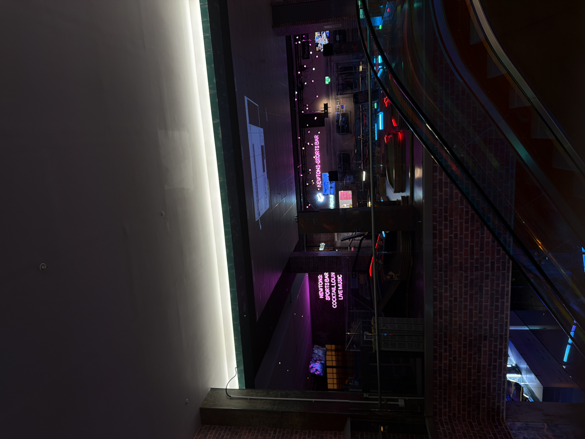 Indoor entertainment venue captured in evening lighting setup