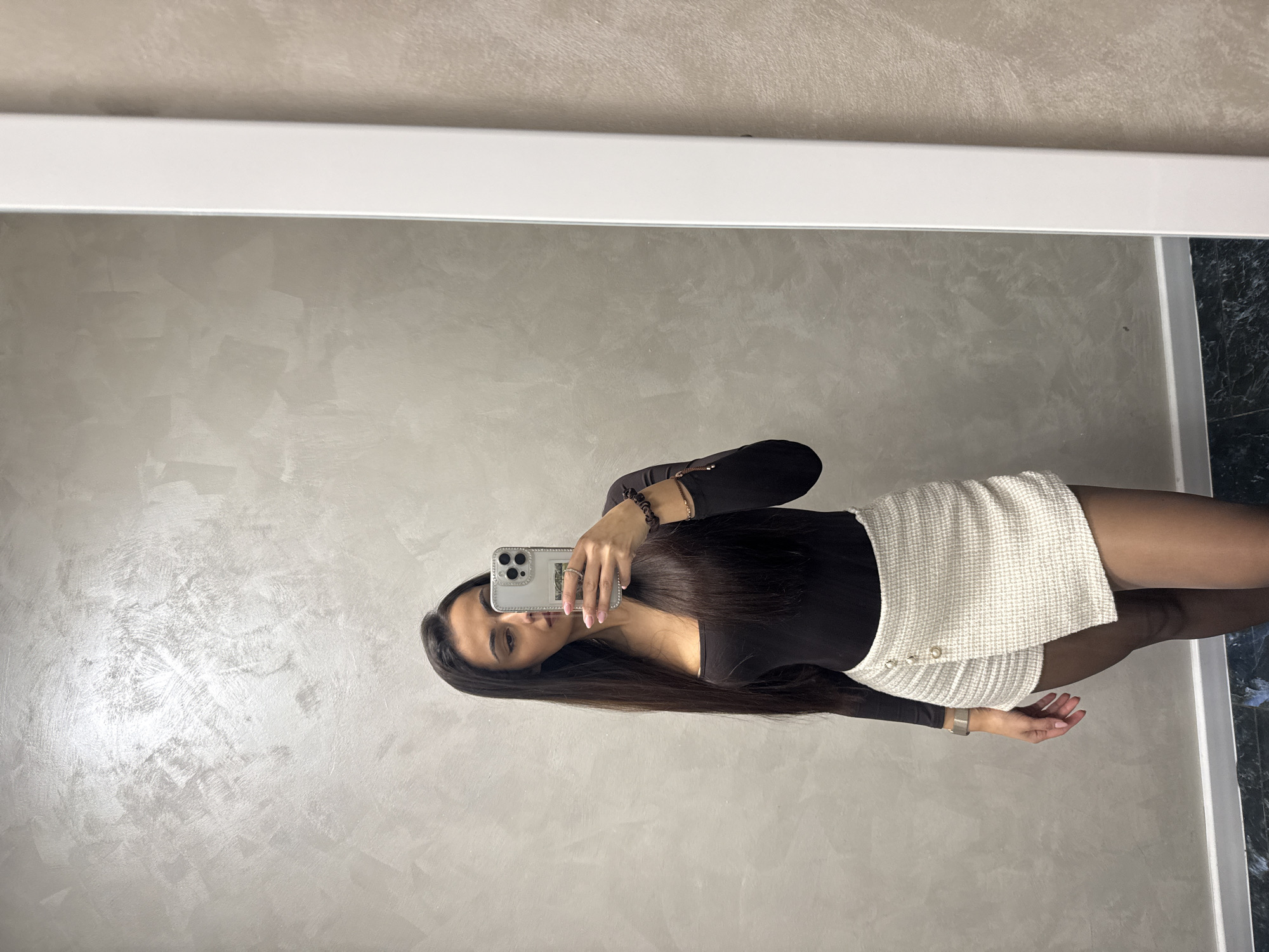 Woman takes mirror selfies indoors in Sofia