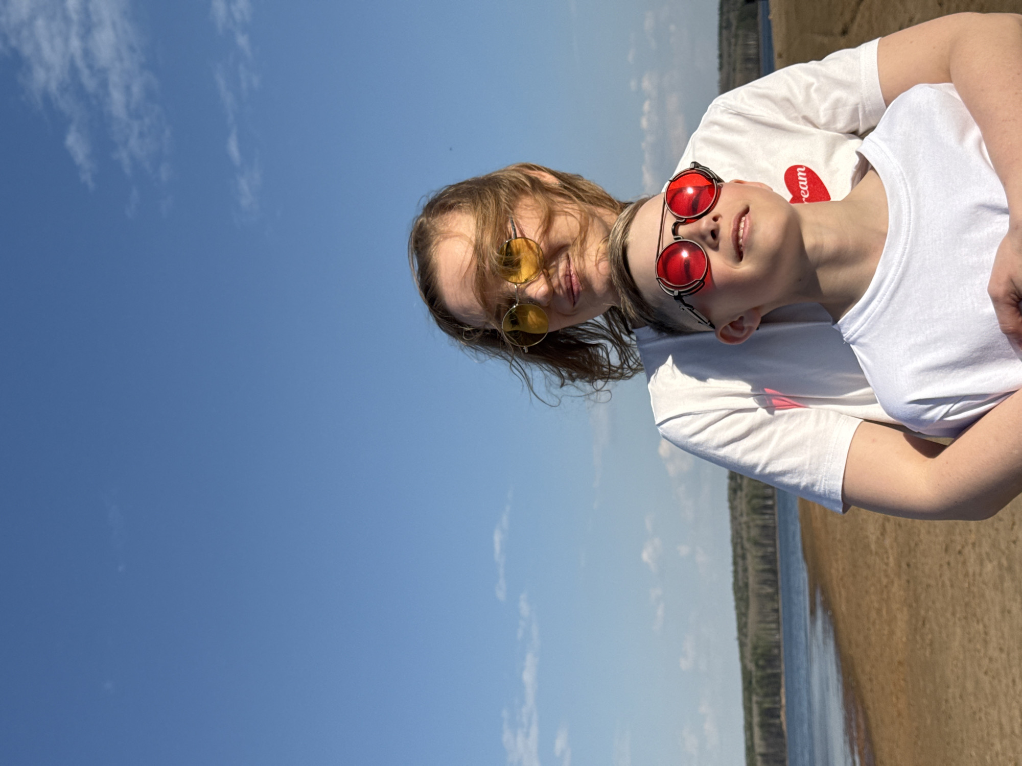 Woman and child enjoy sunny day at Chaikovsky beach