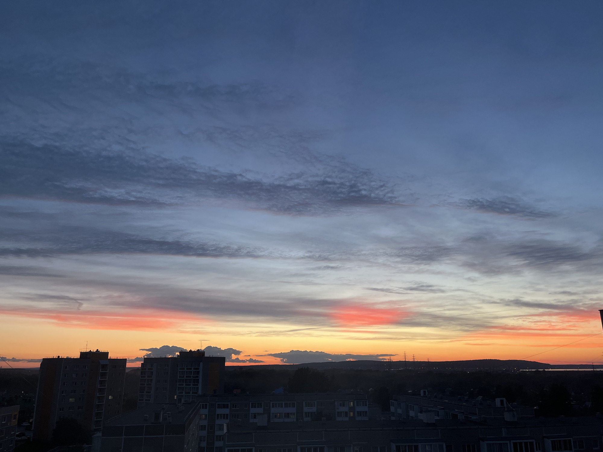 Solstice sunset over Chaikovsky, kids at the playground