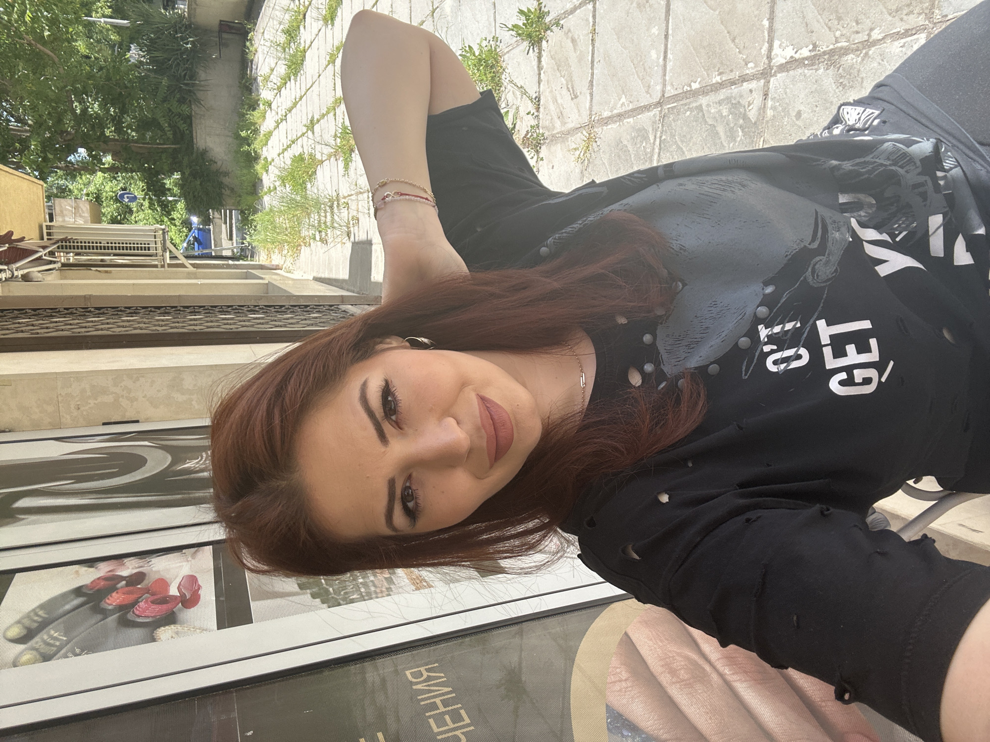 Woman poses with cherries during outdoor photo session in Sofia