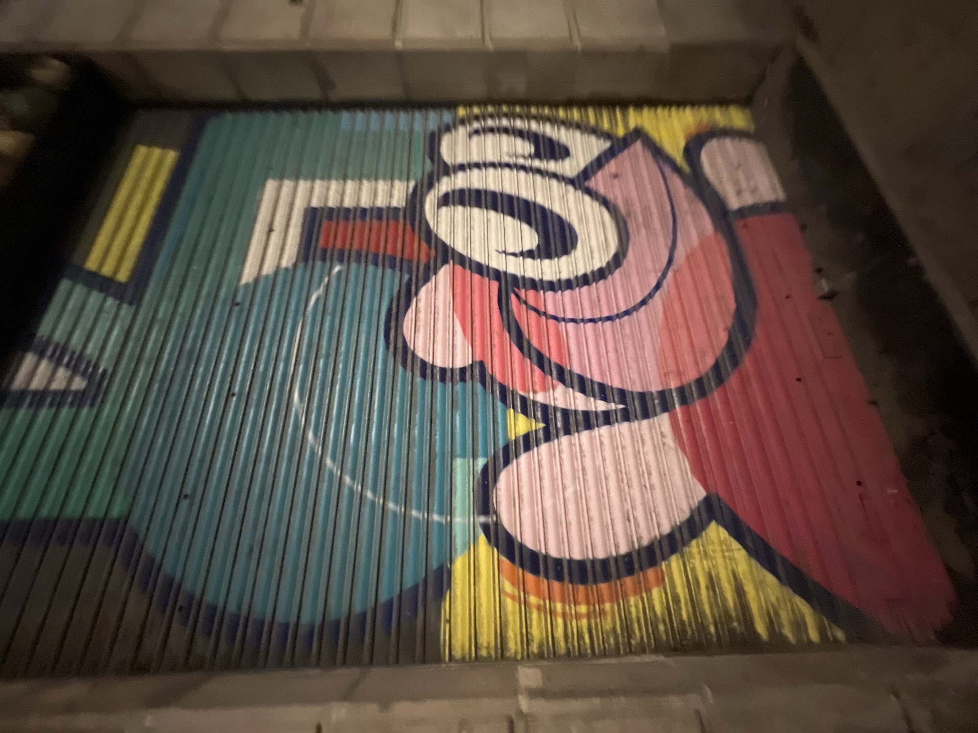 Late-night Barcelona streets: graffiti, wet cobblestones, skating