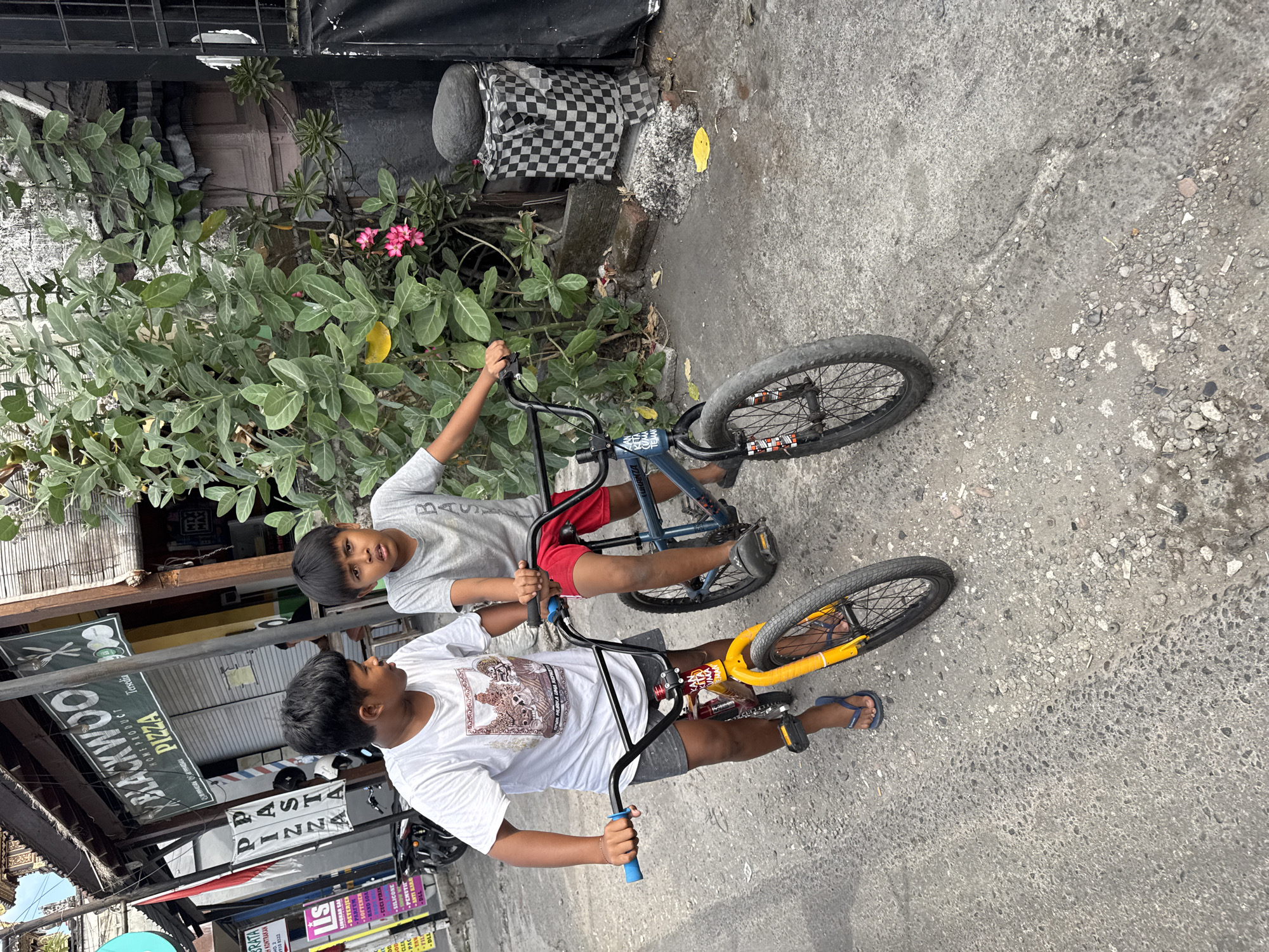 Street-level Denpasar: Balinese temple tower meets everyday traffic