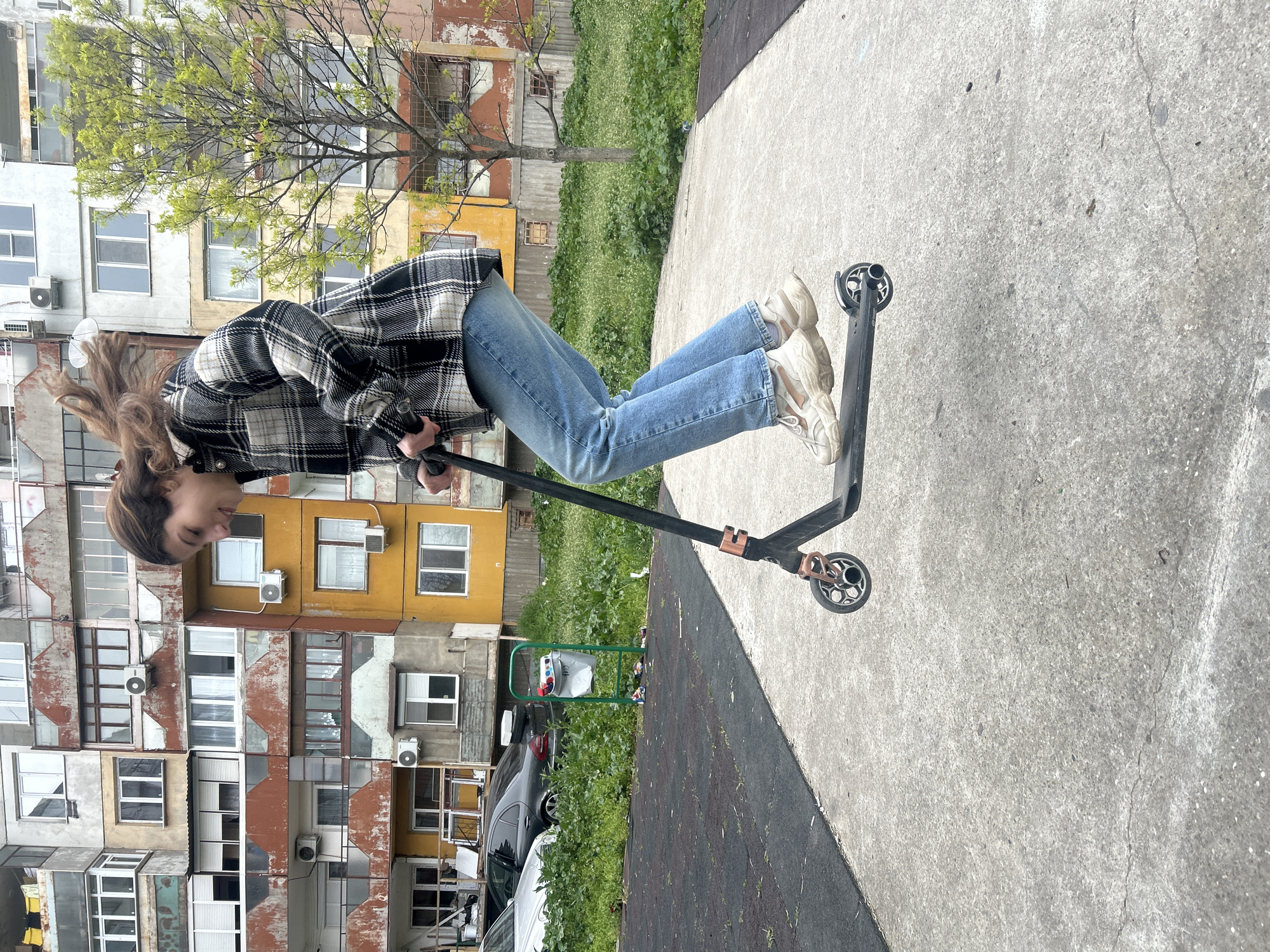 Woman falls off scooter, laughs in Ruse playground