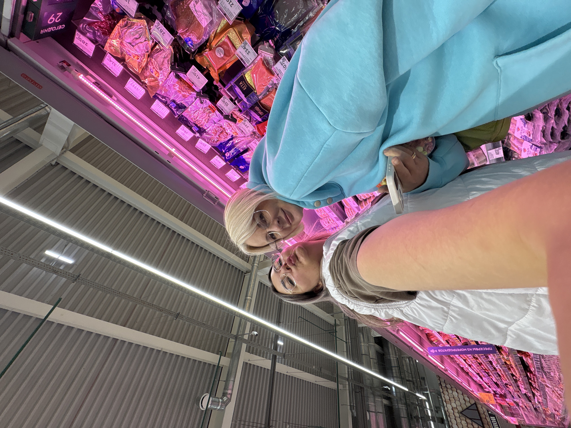 Women document casual shopping trip with selfies in Birobidzhan supermarket