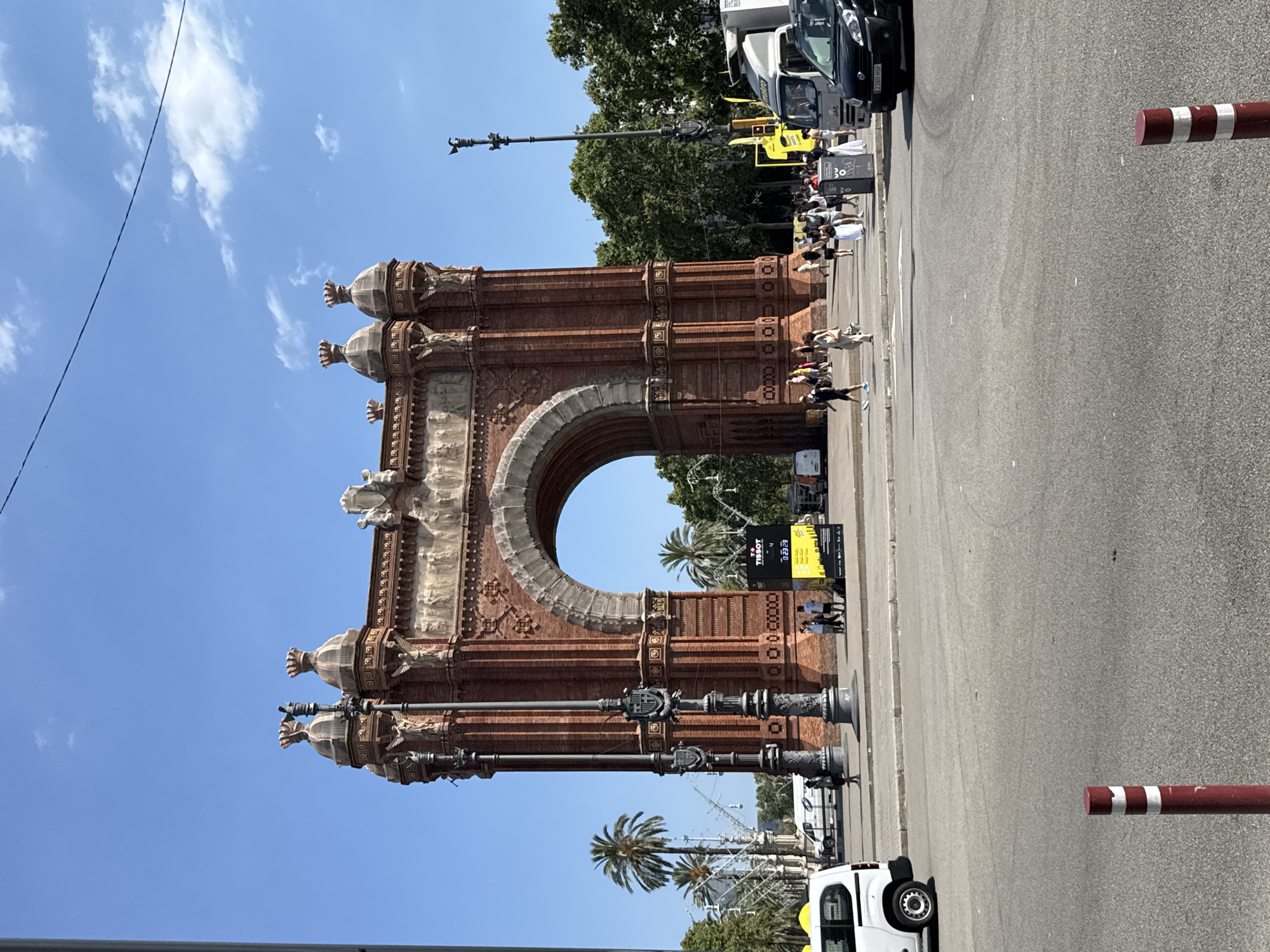 Arc de Triomf, Tour de France flags, and preserved fruits in Barcelona